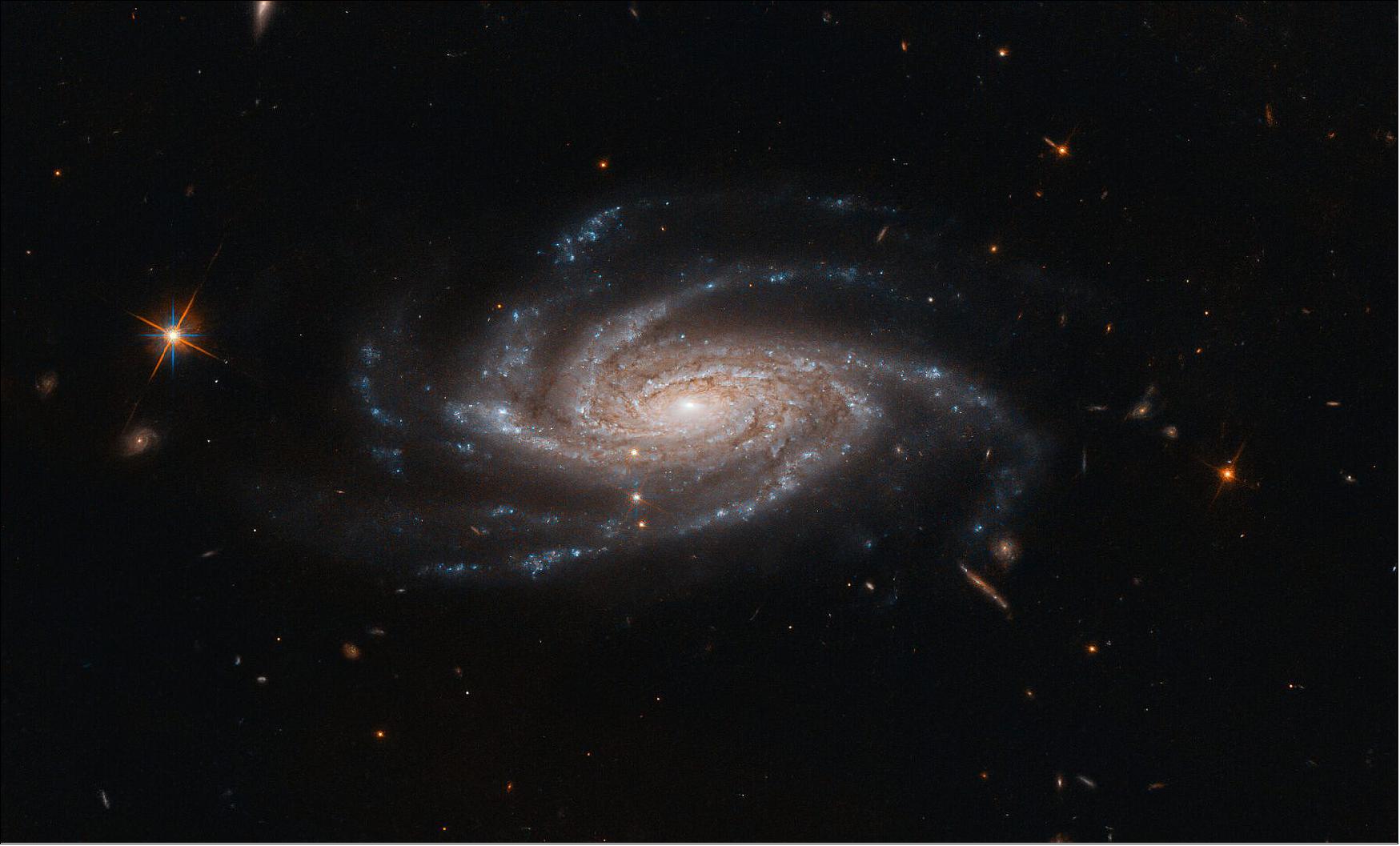 Figure 89: This galaxy is located about 425 million light-years from Earth in the constellation of Pictor (The Painter’s Easel). Discovered in 1834 by astronomer John Herschel, NGC 2008 is categorized as a type Sc galaxy in the Hubble sequence, a system used to describe and classify the various morphologies of galaxies. The “S” indicates that NGC 2008 is a spiral, while the “c” means it has a relatively small central bulge and more open spiral arms. Spiral galaxies with larger central bulges tend to have more tightly wrapped arms, and are classified as Sa galaxies, while those in between are classified as type Sb (image credit: ESA/Hubble & NASA, A. Bellini; CC BY 4.0)