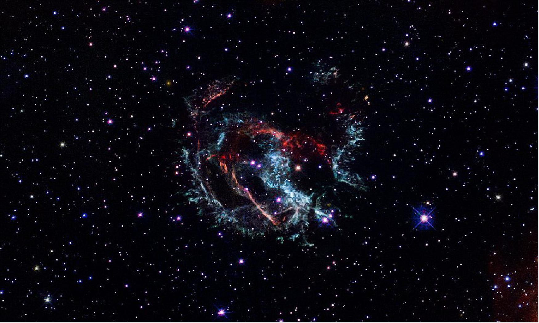 Figure 124: Hubble Captures the Supernova Remnant 1E 0102.2-7219. This Hubble Space Telescope portrait reveals the gaseous remains of an exploded massive star that erupted approximately 1,700 years ago. The stellar corpse, a supernova remnant named 1E 0102.2-7219, met its demise in the Small Magellanic Cloud, a satellite galaxy of our Milky Way [image credits: NASA, ESA, and J. Banovetz and D. Milisavljevic (Purdue University)]