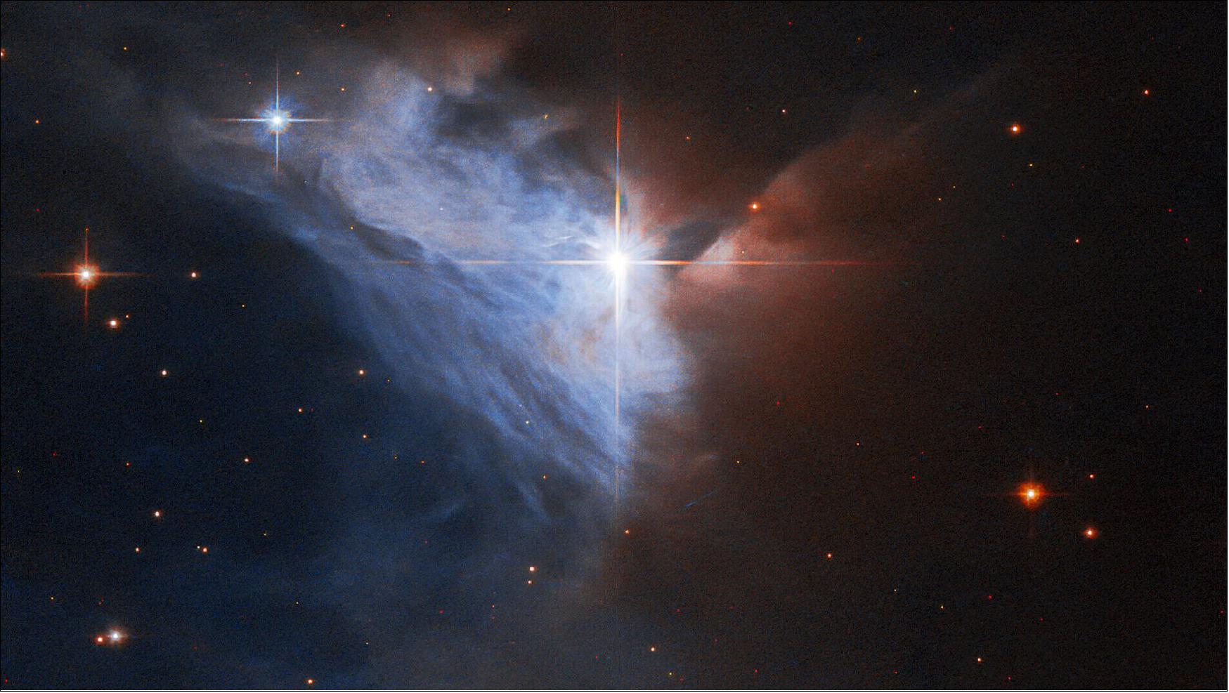 Figure 87: This Picture of the Week showcases the emission nebula NGC 2313. The bright star V565 — surrounded by four prominent diffraction spikes — illuminates a silvery, fan-shaped veil of gas and dust, while the right half of this image is obscured by a dense cloud of dust. Nebulae with similar shapes — a star accompanied by a bright fan of gas — were once referred to as cometary nebulae, though the name is no longer used (image credit: ESA/Hubble, R. Sahai; CC BY 4.0)
