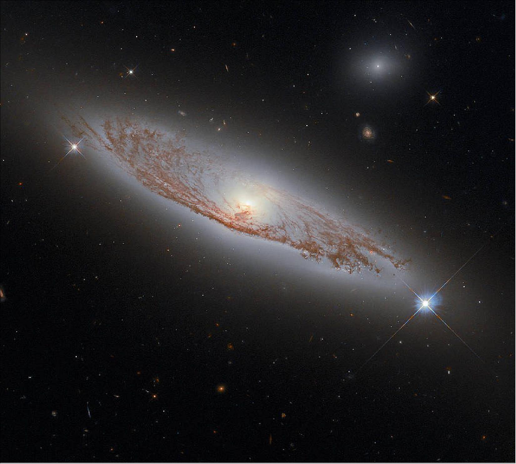 Figure 83: This image shows the spiral galaxy NGC 5037, in the constellation of Virgo. First documented by William Herschel in 1785, the galaxy lies about 150 million light-years away from Earth. Despite this distance, we can see the delicate structures of gas and dust within the galaxy in extraordinary detail. This detail is possible using Hubble’s WFC3, whose combined exposures created this image (image credit: ESA/Hubble & NASA, D. Rosario; Acknowledgment: L. Shatz)