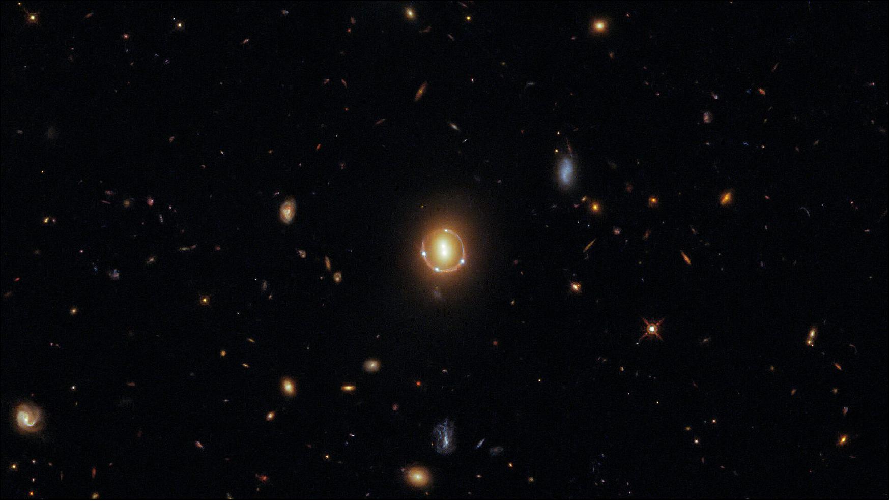 Figure 57: These galaxies were imaged in spectacular detail by Hubble’s Wide Field Camera 3 (WFC3), which was installed on Hubble in 2009 during Hubble Servicing Mission 4, Hubble’s final servicing mission. The WFC3 was intended to operate until 2014, but 12 years after it was installed it continues to provide both top-quality data and fantastic images, such as this one (image credit: ESA/Hubble & NASA, T. Treu; CC BY 4.0 Acknowledgment: J. Schmidt)
