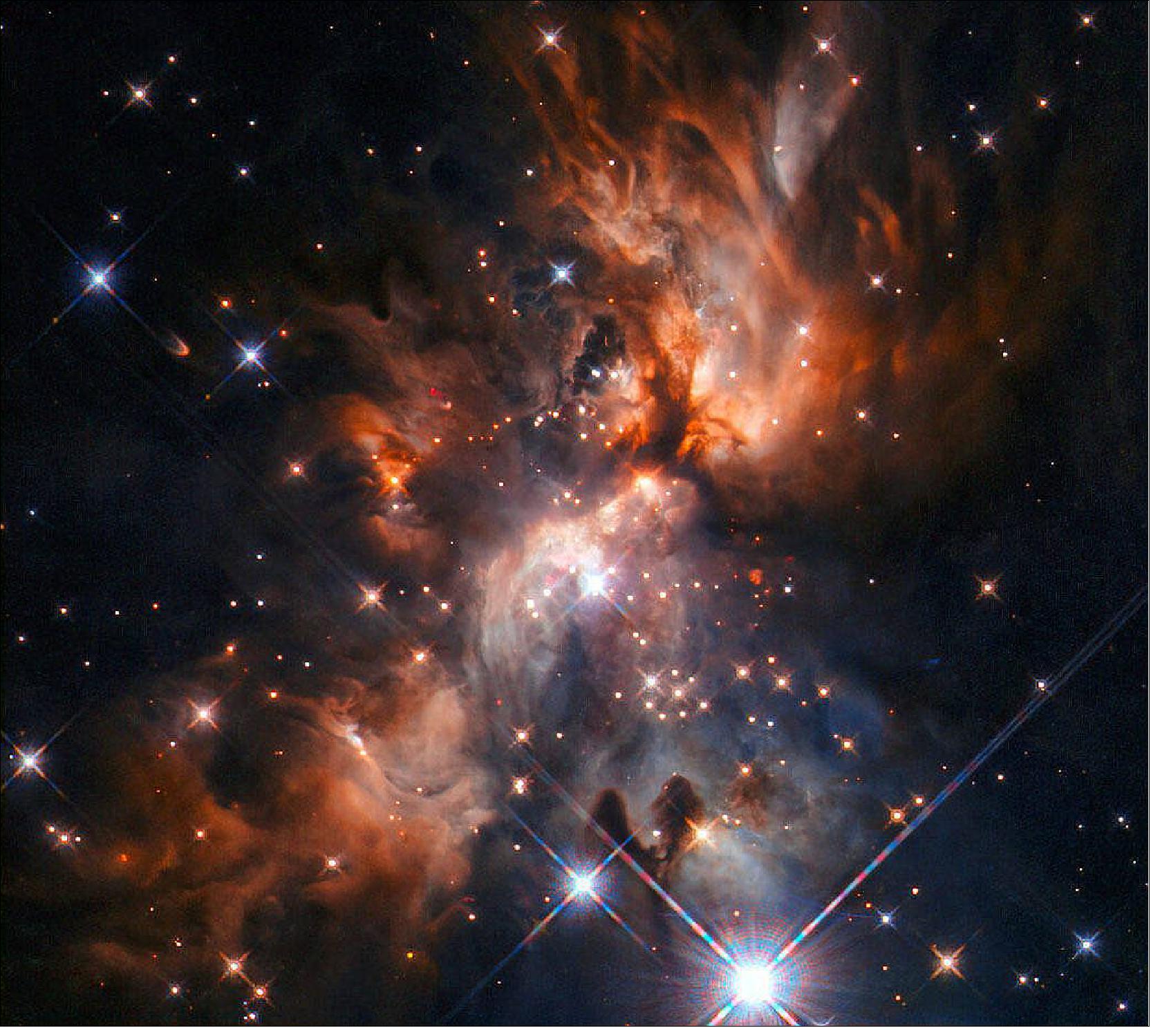 Figure 56: This image from the NASA/ESA Hubble Space Telescope features AFGL 5180, a beautiful stellar nursery located in the constellation of Gemini (the Twins). At the center of the image, a massive star is forming and blasting cavities through the clouds with a pair of powerful jets, extending to the top right and bottom left of the image. Light from this star is mostly escaping and reaching us by illuminating these cavities, like a lighthouse piercing through the storm clouds [Text credit: European Space Agency (ESA), image credit: ESA/Hubble & NASA, J. C. Tan (Chalmers University & University of Virginia), R. Fedriani (Chalmers University); Acknowledgment: Judy Schmidt]