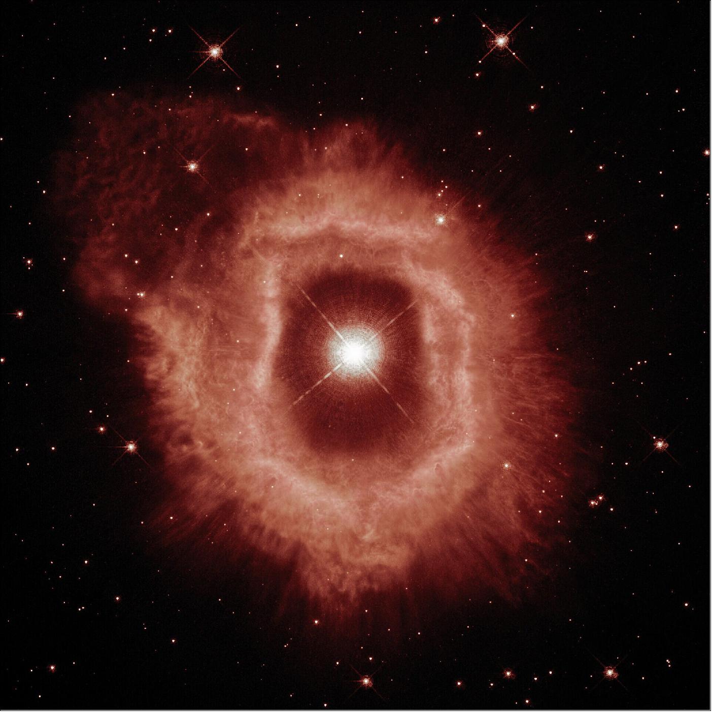 Figure 48: This first image of AG Carinae showcases the details of the ionized hydrogen and ionized nitrogen emissions from the nebula (seen here in red), image credit: ESA/Hubble and NASA, A. Nota, C. Britt; CC BY 4.0
