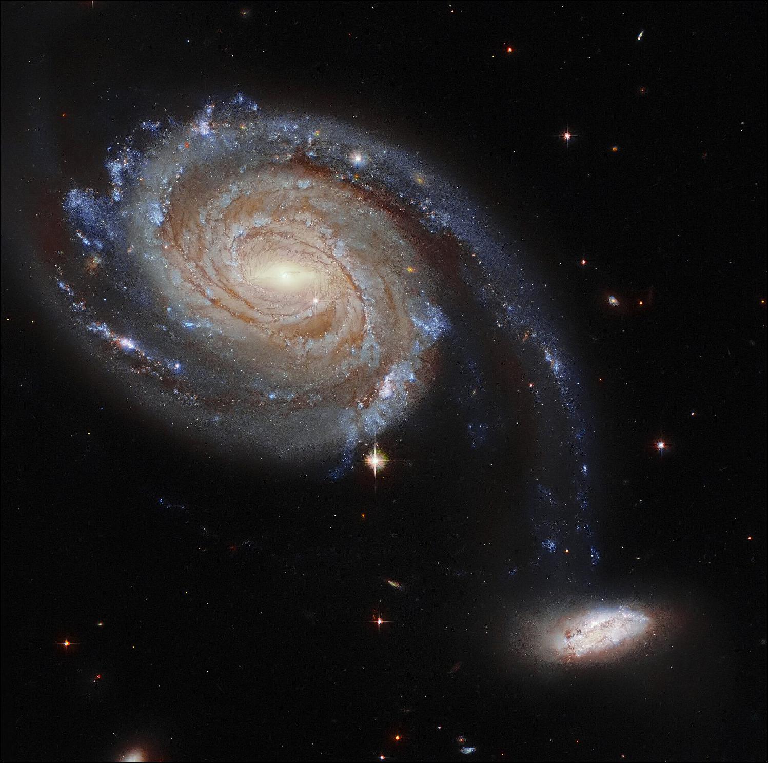 Figure 36: Hubble observed Arp 86 as part of a larger effort to understand the connections between young stars and the clouds of cold gas in which they form. Hubble gazed into star clusters and clouds of gas and dust in a variety of environments dotted throughout nearby galaxies. Combined with measurements from ALMA, a gigantic radio telescope perched high in the Chilean Andes, these Hubble observations provide a treasure trove of data for astronomers working to understand how stars are born (image credit: ESA/Hubble and NASA, Dark Energy Survey, J. Dalcanton; CC BY 4.0)