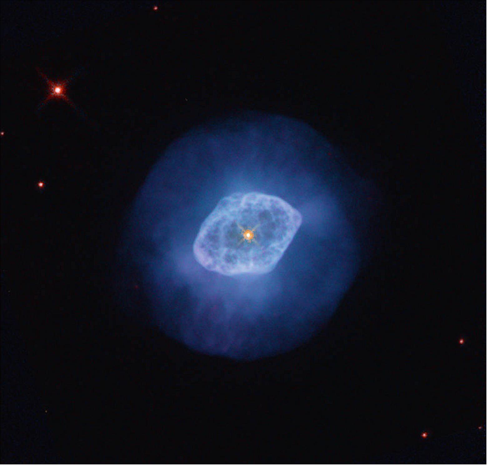 Figure 8: Hubble studied NGC 6891 as part of efforts to gauge the distances to nebulae, and to learn more about how their structures formed and evolved. NGC 6891 is made up of gas that’s been ionized by the central white dwarf star, which stripped electrons from the nebula’s hydrogen atoms. As the energized electrons revert from their higher-energy state to a lower-energy state by recombining with the hydrogen nuclei, they emit energy in the form of light, causing the nebula’s gas to glow [image credit: NASA, ESA, A. Hajian (University of Waterloo), H. Bond (Pennsylvania State University), and B. Balick (University of Washington); Processing: Gladys Kober (NASA/Catholic University of America)]