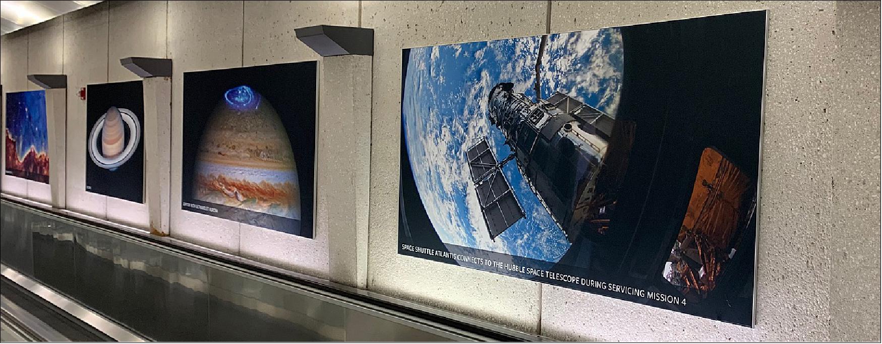 Figure 2: The new "Hubble Hallway" on display at the Washington Dulles International Airport features images and spectra spanning the breadth of Hubble science, from the local cosmic neighborhood of our solar system, to planets orbiting other stars, to colorful nebulas and distant galaxies in the first eons of the universe. The exhibit lines a section of the walls of the 300-foot-long hallway between Dulles' main terminal and the airport's parking garages and future Metrorail stop (image credit: STScI)