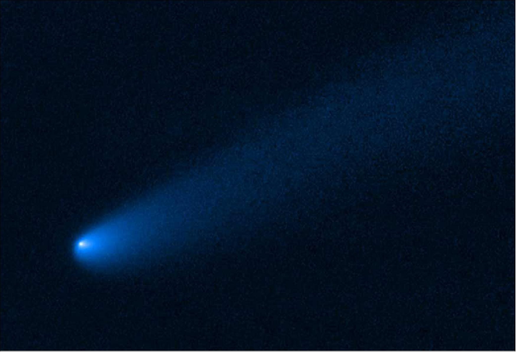 Figure 113: Hubble Trojan comet. NASA's Hubble Space Telescope snapped this image of the young comet P/2019 LD2 as it orbits near Jupiter's captured ancient asteroids, which are called Trojans. The Hubble view reveals a 400,000-mile-long tail of dust and gas flowing from the wayward comet's bright solid nucleus. This Hubble visible-light image is a combination of exposures taken April 1 and May 8, 2020, with the Wide Field Camera 3 (image credit: NASA/ESA/J. Olmsted/STScI)