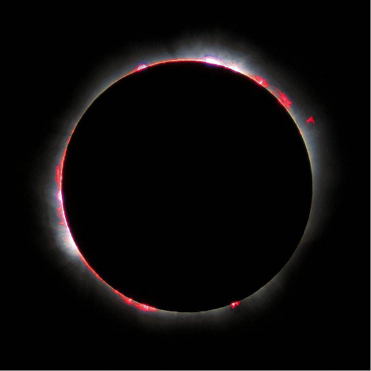 Figure 7: The chromosphere, photographed during the 1999 total solar eclipse. The red and pink hues – light emitted by hydrogen – earned it the name chromosphere, from the Greek “chrôma” meaning color (image credit: Luc Viatour)