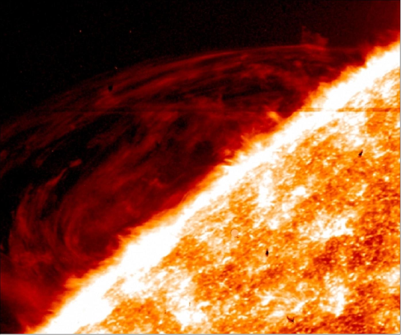 Figure 23: The fine detail in images of prominences in the sun's atmosphere from NASA's IRIS mission – such as the red swirls shown here – are challenging the way scientists understand such events (image credit: NASA, LMSAL, IRIS collaboration)