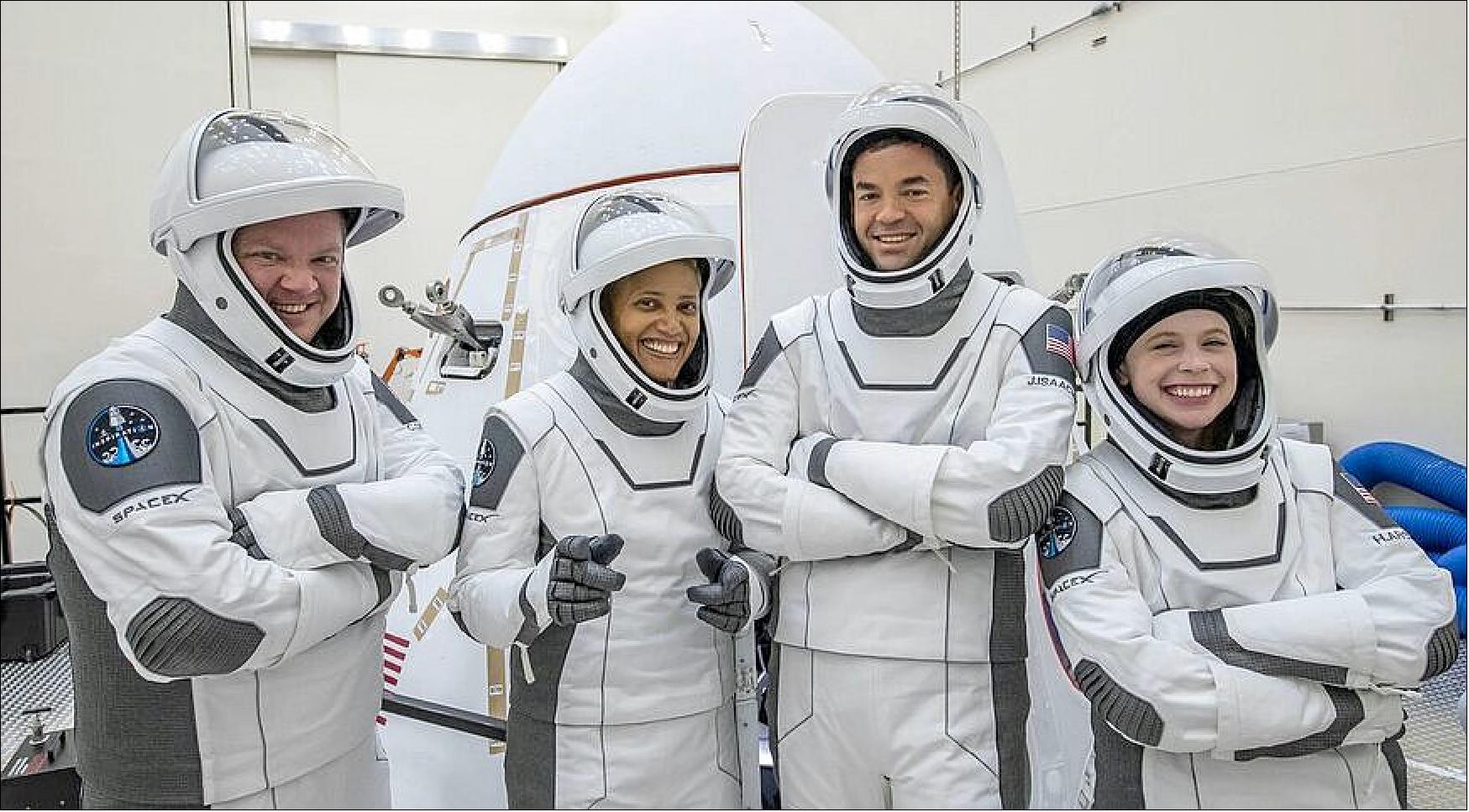 Figure 3: The Inspiration4 crew of (from left) Chris Sembroski, Sian Proctor, Jared Isaacman and Hayley Arceneaux pose with their Crew Dragon spacecraft ahead of their mid-September launch (image credit: Inspiration4)