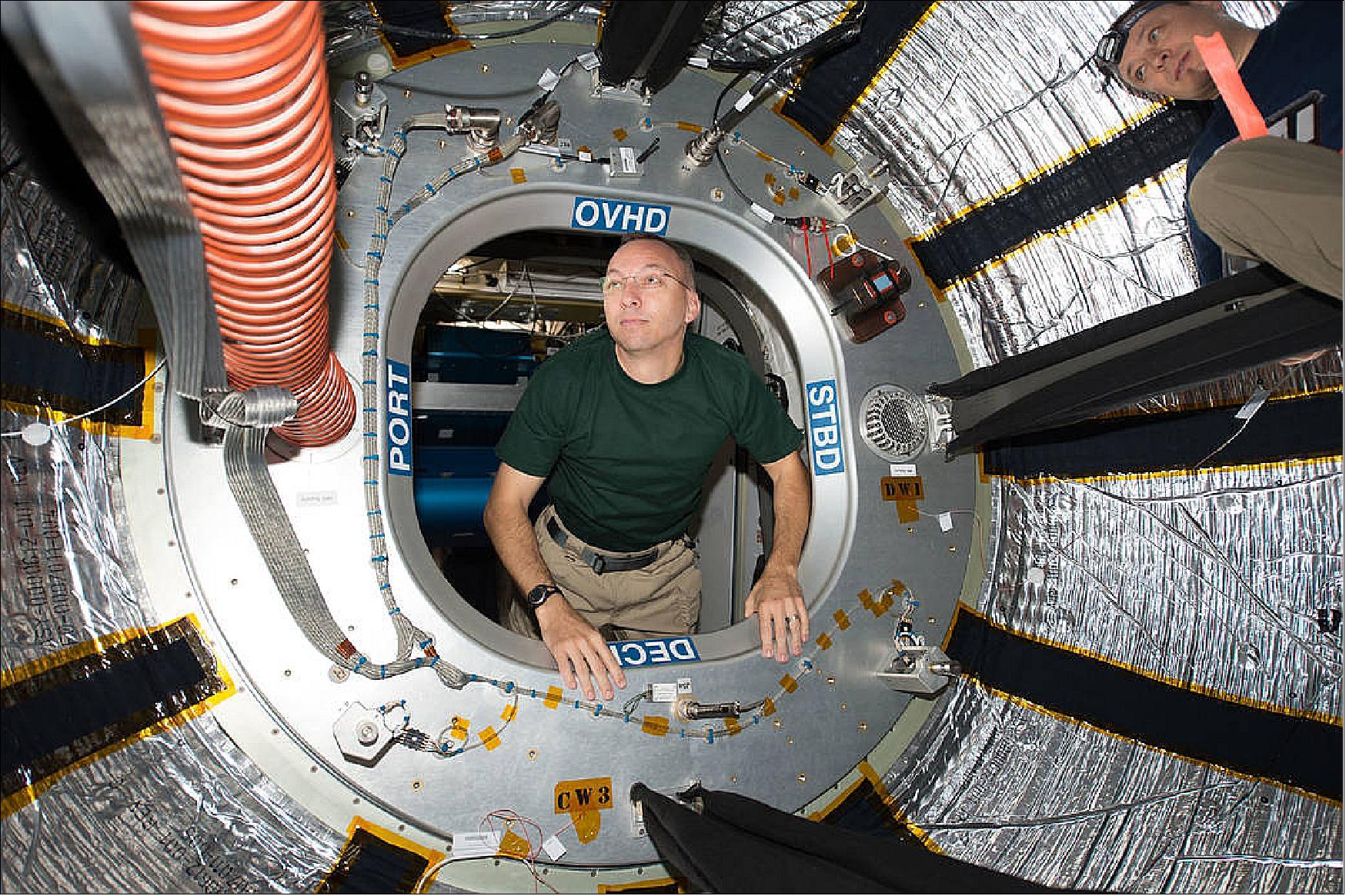Figure 7: NASA astronaut Randy Bresnik looks through the hatch of the International Space Station's Bigelow Expandable Aerospace Module (BEAM) on July 31, 2017. He shared this photo on social media on August 2, commenting, "Ever wonder how you look when you enter a new part of a spacecraft? Well, this is it. First time inside the expandable BEAM module." (image credit: NASA) 21)