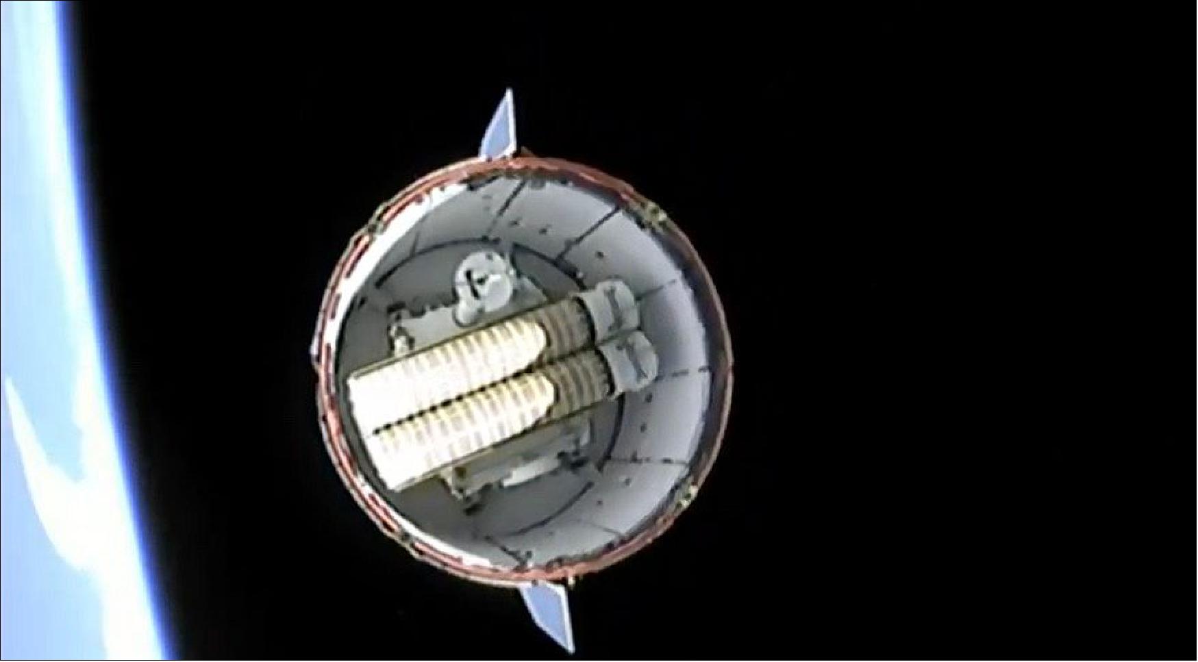 Figure 2: A SpaceX cargo Dragon spacecraft after separation from the upper stage of its Falcon 9 rocket June 3. Visible in the trunk section of the Dragon are two solar arrays, in their rolled-up configuration, that will be installed on the space station (image credit: NASA TV)