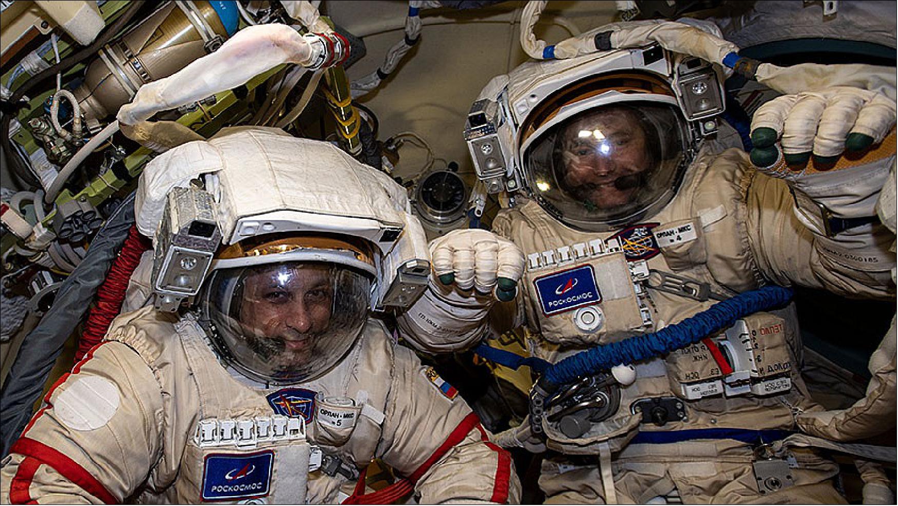 Figure 20: Cosmonauts (from left) Anton Shkaplerov and Pyotr Dubrov are pictured in their Russian Orlan spacesuits for a fit check and leak checks on Jan. 14 (image credit: NASA TV)