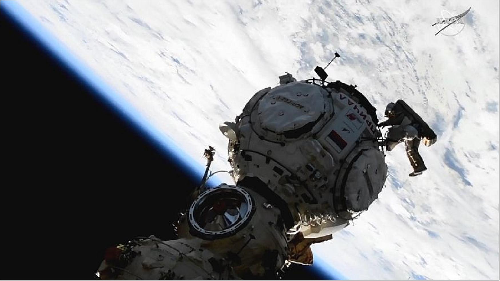 Figure 19: Cosmonaut Pyotr Dubrov works to configure and activate the Prichal module during a spacewalk on Jan. 19, 2022 (image credit: NASA TV)