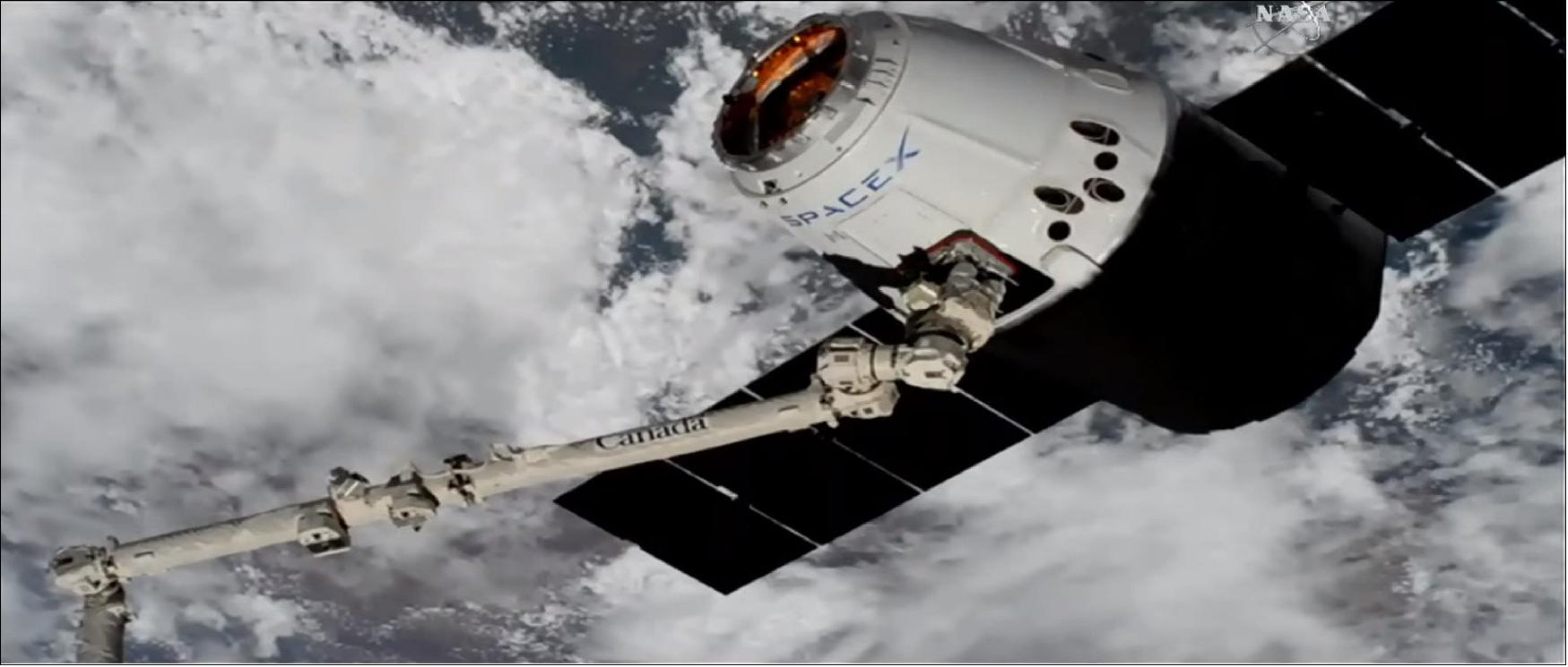 Figure 24: Astronauts aboard the ISS snagged the uncrewed Dragon today (April 4) at 10:40 GMT using the orbiting lab's huge Canadarm2 robotic arm (image credit: NASA TV)