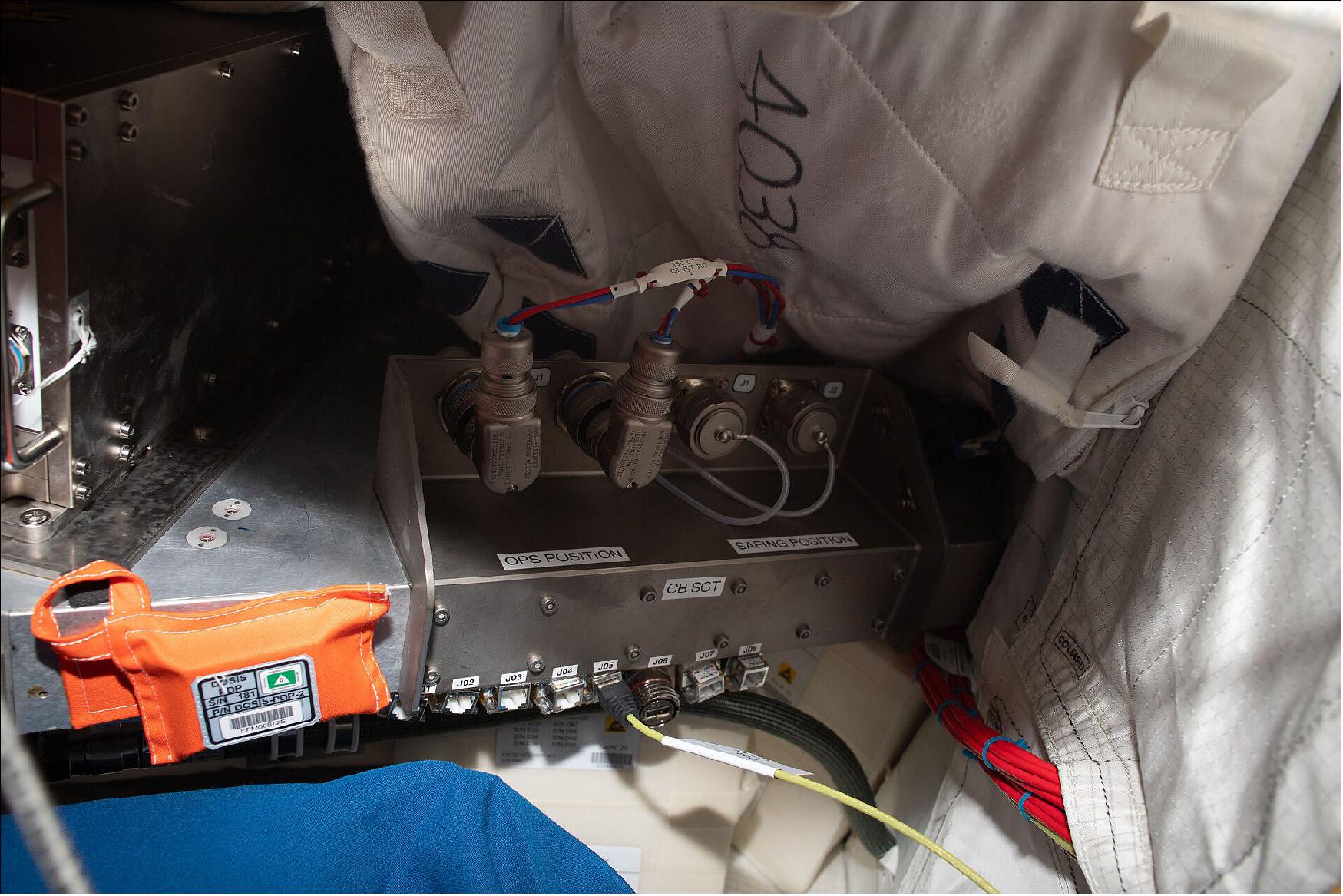 Figure 7: Orange Dosis-3D pouches are everywhere in the Columbus laboratory on the International Space Station. A series of active and passive dosimeters, they measure space radiation inside the module as well as how it penetrates the Space Station’s walls (image credit: ESA/NASA)