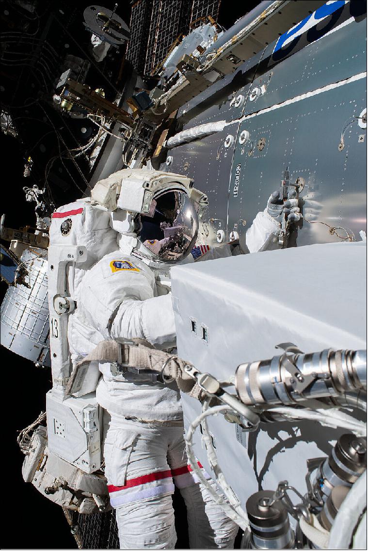 Figure 5: The ColKa communications device was installed during a spacewalk. Europe strengthened its connection to space on Wednesday 27 January 2021, as NASA astronauts Mike Hopkins (white suit with red stripes) and Victor Glover (plain white suit) installed the Columbus KA-band antenna (ColKa) outside ESA’s Columbus laboratory on the International Space Station. (image credit: ESA/NASA)