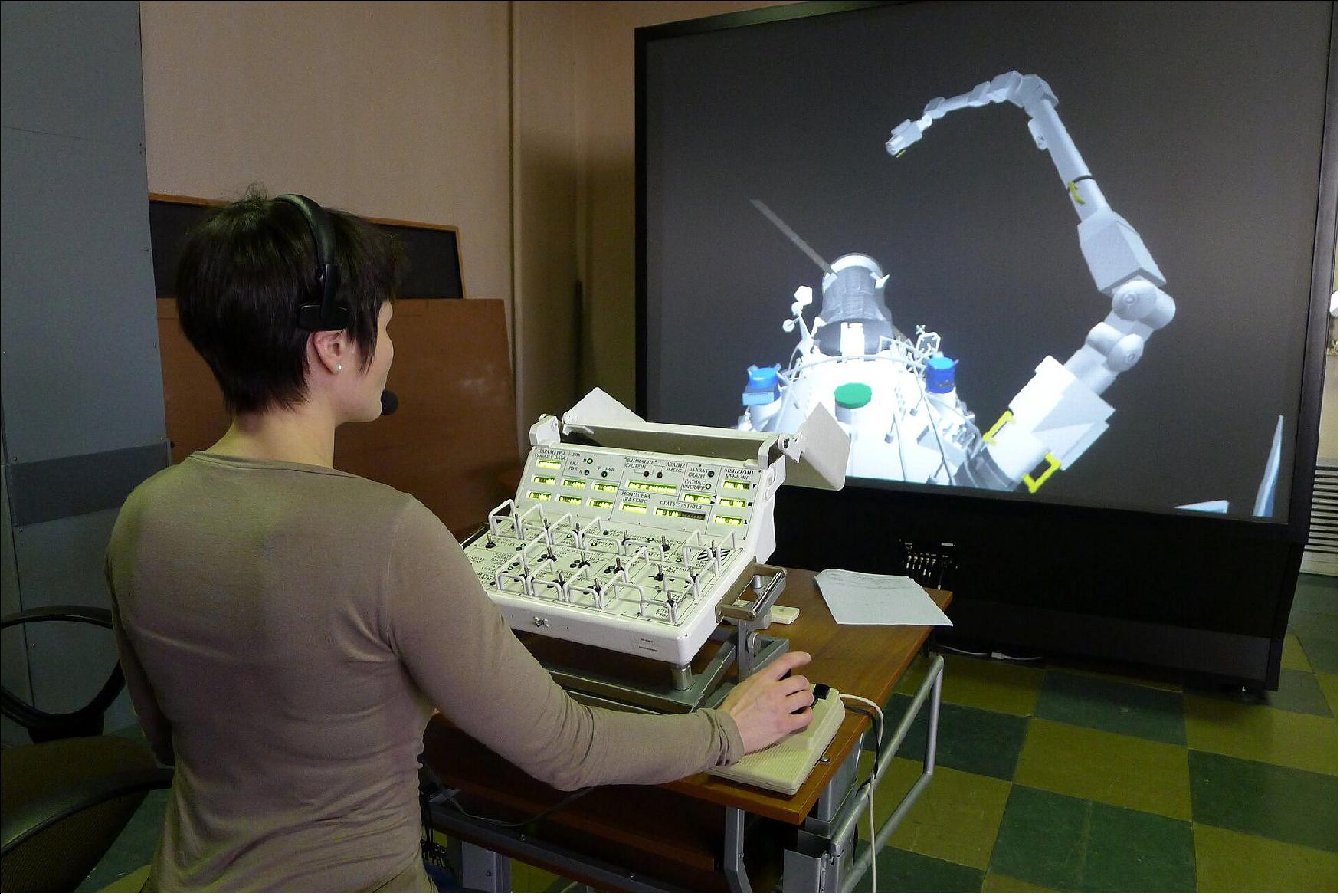 Figure 14: ESA astronaut Samantha Cristoforetti trains with the European Robotic Arm (ERA) simulator at the Gagarin Cosmonaut Training Center (GCTC) in Moscow, Russia. It will take five spacewalks to get the robotic arm fit for space operations. ESA astronauts Matthias Maurer and Samantha Cristoforetti will support the installation both from inside and outside the Station by taking part in a few spacewalks. ERA’s first tasks in orbit are to set up the airlock and install a large radiator for the Multipurpose Laboratory Module, also called ‘Nauka’ (image credit: GCTC)