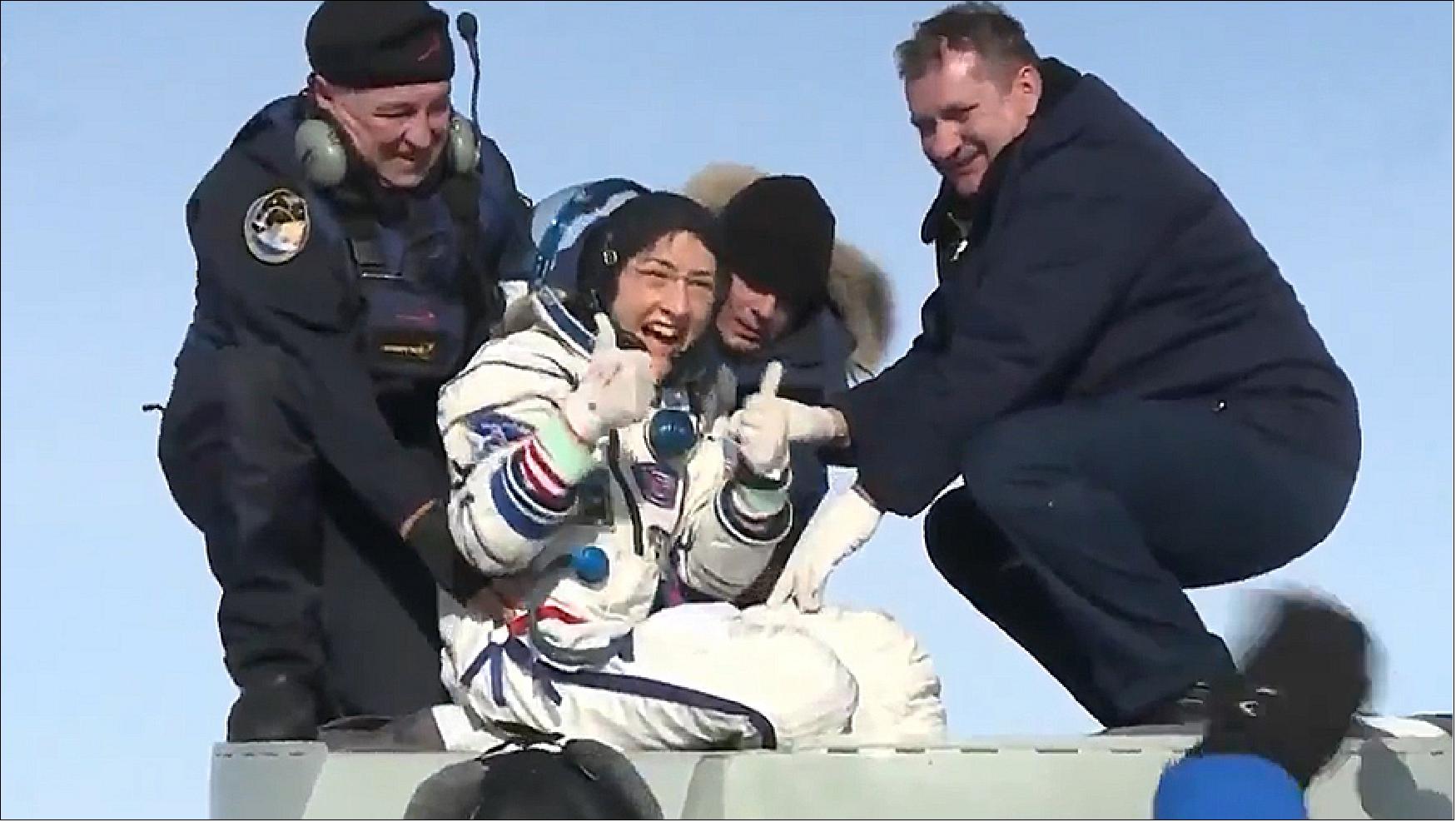 Figure 110: Astronaut Christina Koch smiles as she gives a "thumbs up" sign shortly after being extracted from the Soyuz MS-13 crew ship that brought her home after 328 days in space (image credit: NASA TV)