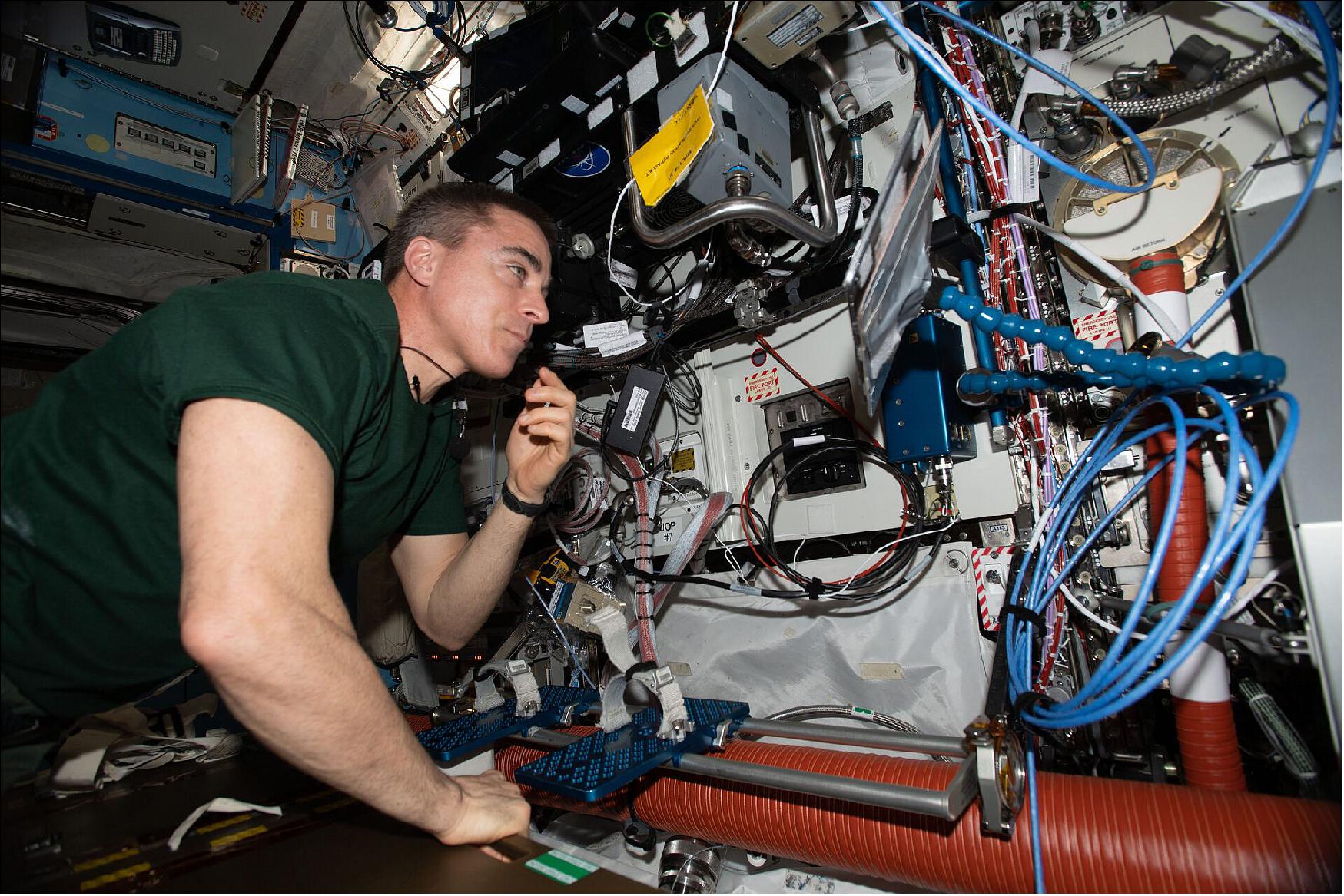 Figure 39: Expedition 63 Commander Chris Cassidy works on computer maintenance (image credit: NASA)