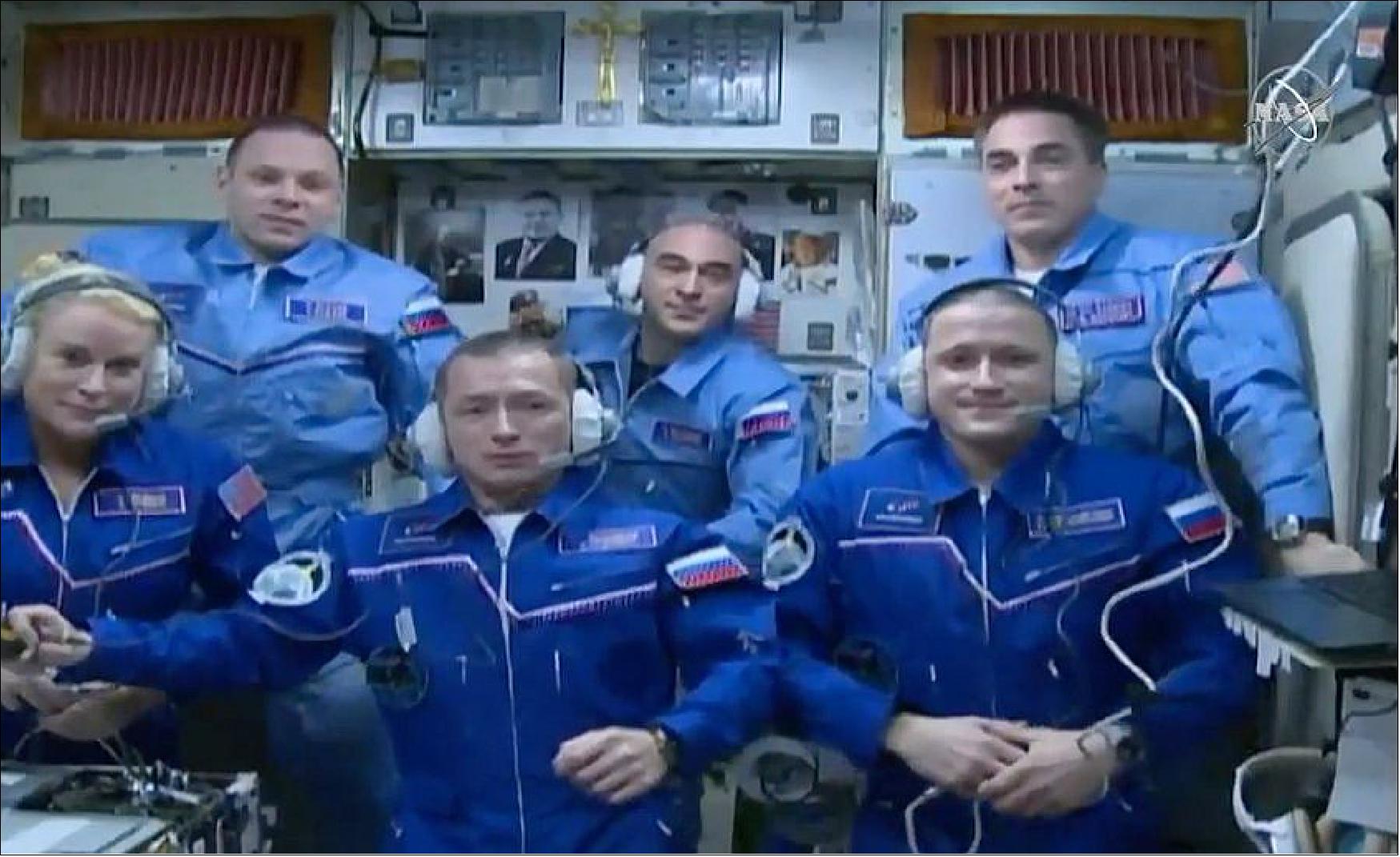 Figure 36: NASA astronaut Kate Rubins, Soyuz commander Sergey Ryzhikov, and flight engineer Sergey Kud-Sverchkov have joined the International Space Station crew after docking a few hours ago. Front row from left: Expedition 64 crew members Kate Rubins, Sergey Ryzhikov and Sergey Kud-Sverchkov join Expedition 63 crew members (back row from left) Ivan Vagner, Anatoly Ivanishin and Chris Cassidy inside the space station’s Zvezda service module (image credit: NASA TV)