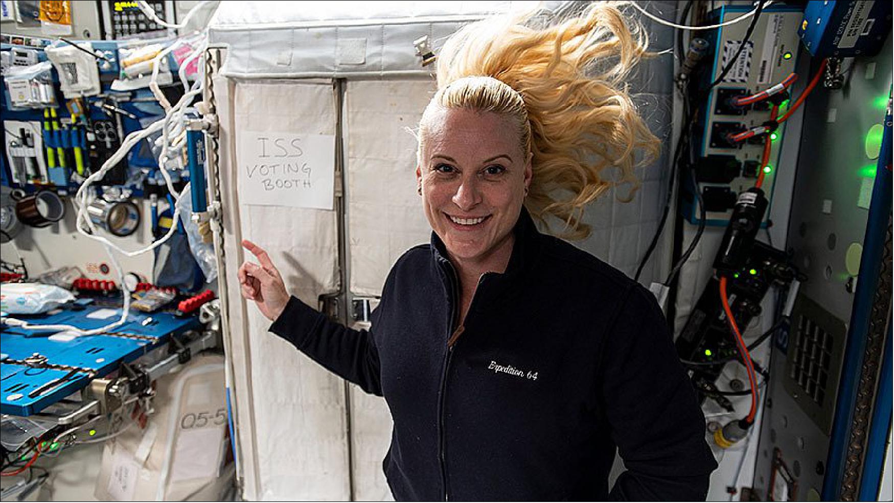 Figure 27: NASA astronaut and Expedition 64 Flight Engineer Kate Rubins points to the International Space Station’s “voting booth” where she cast her vote from space this month (image credit: NASA)