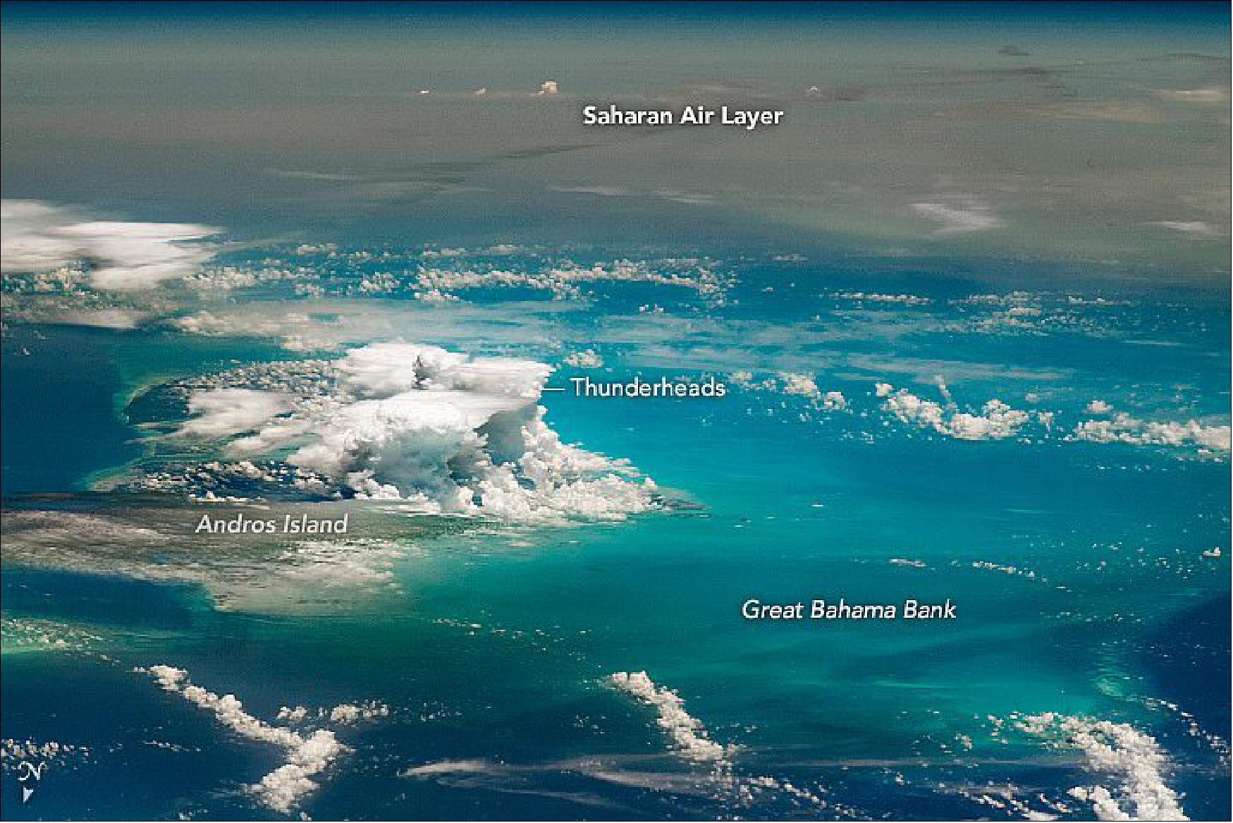 Figure 9: A towering thunder cloud stands at the intersection of moist tropical air and dry, dusty plumes. The astronaut photograph ISS063-E-32223 was acquired on June 23, 2020, with a Nikon D5 digital camera using a 400 mm lens and is provided by the ISS Crew Earth Observations Facility and the Earth Science and Remote Sensing Unit, Johnson Space Center. The image was taken by a member of the Expedition 63 crew (image credit: NASA Earth Observatory, caption by Justin Wilkinson)