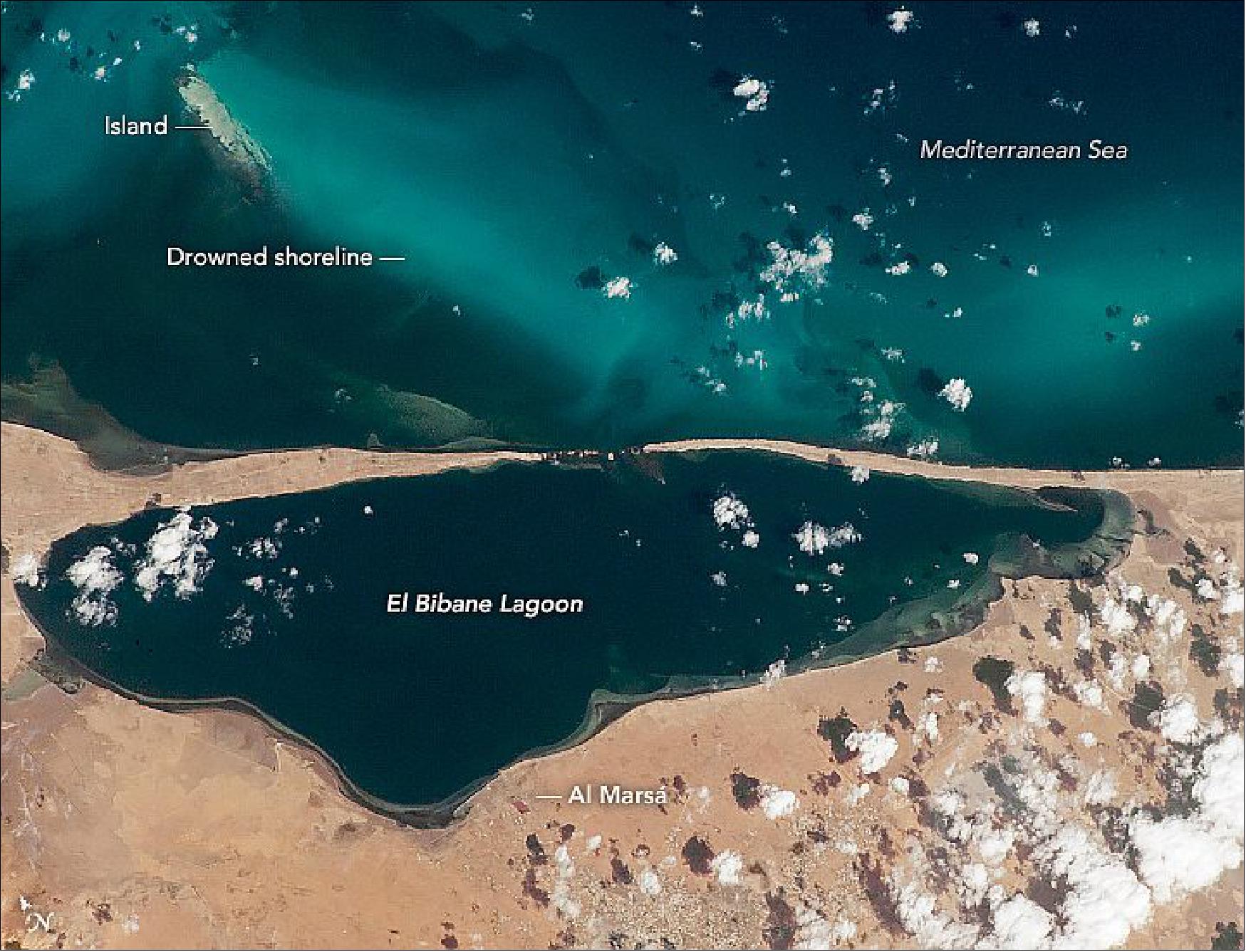 Figure 1: This portion of the Tunisian coast is a sheltering harbor for fish, shorebirds, and Mars-like life. The astronaut photograph ISS064-E-424 was acquired on October 25, 2020, with a Nikon D5 digital camera using a 460 mm lens and is provided by the ISS Crew Earth Observations Facility and the Earth Science and Remote Sensing Unit, Johnson Space Center. The image was taken by a member of the Expedition 64 crew (image credit: NASA Earth Observatory, caption by Justin Wilkinson)