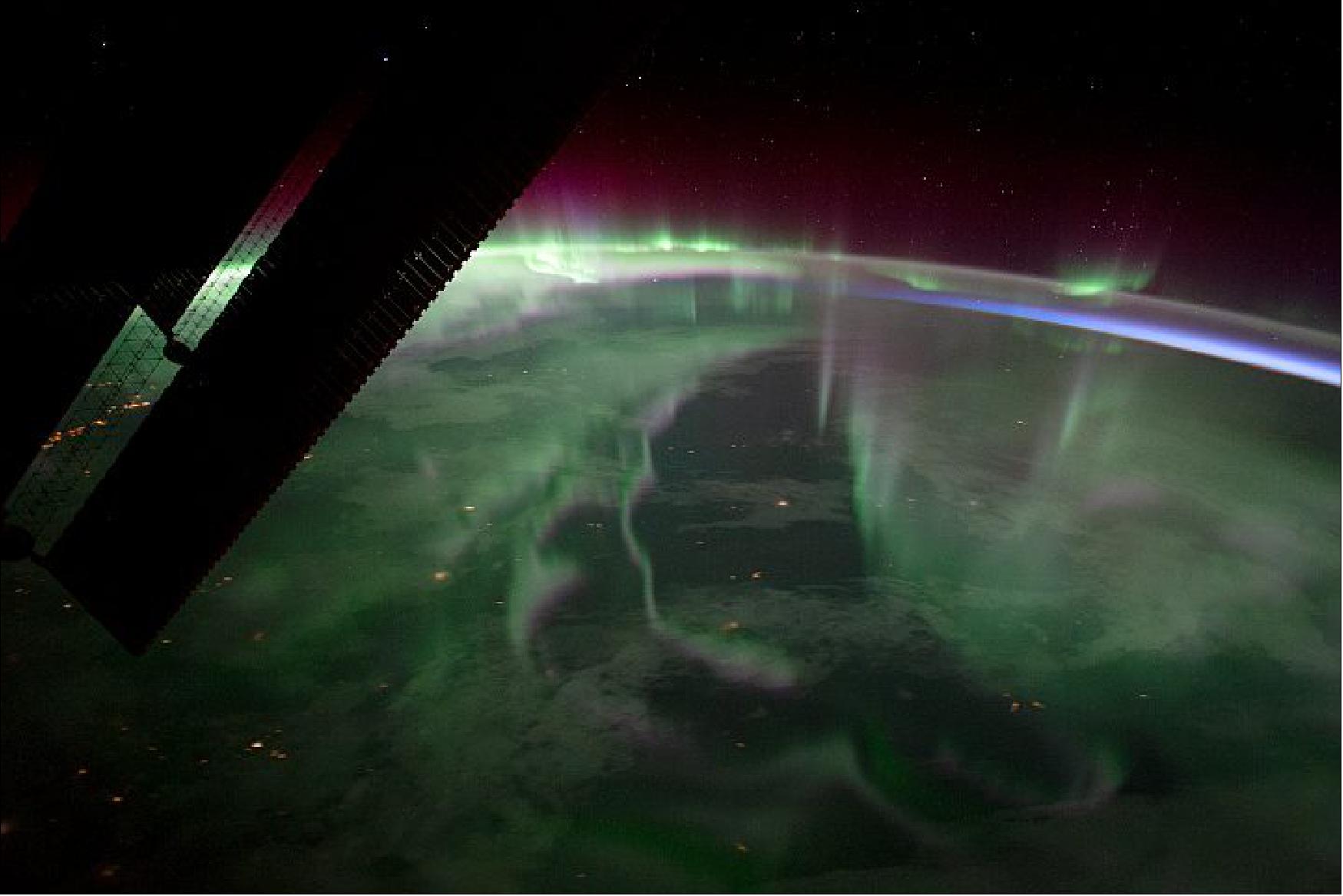 Figure 124: Astronauts have snapped numerous photos of the light show from their unique perch on the International Space Station. Astronaut Randy "Komrade" Bresnik shot this photograph on September 15, 2017, as the space station passed over Ontario, Canada. Curtains of green—the most familiar color of auroras—dominate the light show, with hints of purple and red. This astronaut photograph ISS053-E- 23965 was acquired with a Nikon D4 digital camera using a 24 mm lens and is provided by the ISS Crew Earth Observations Facility and the Earth Science and Remote Sensing Unit, Johnson Space Center (image credit: NASA Earth Observatory, story by Kathryn Hansen)