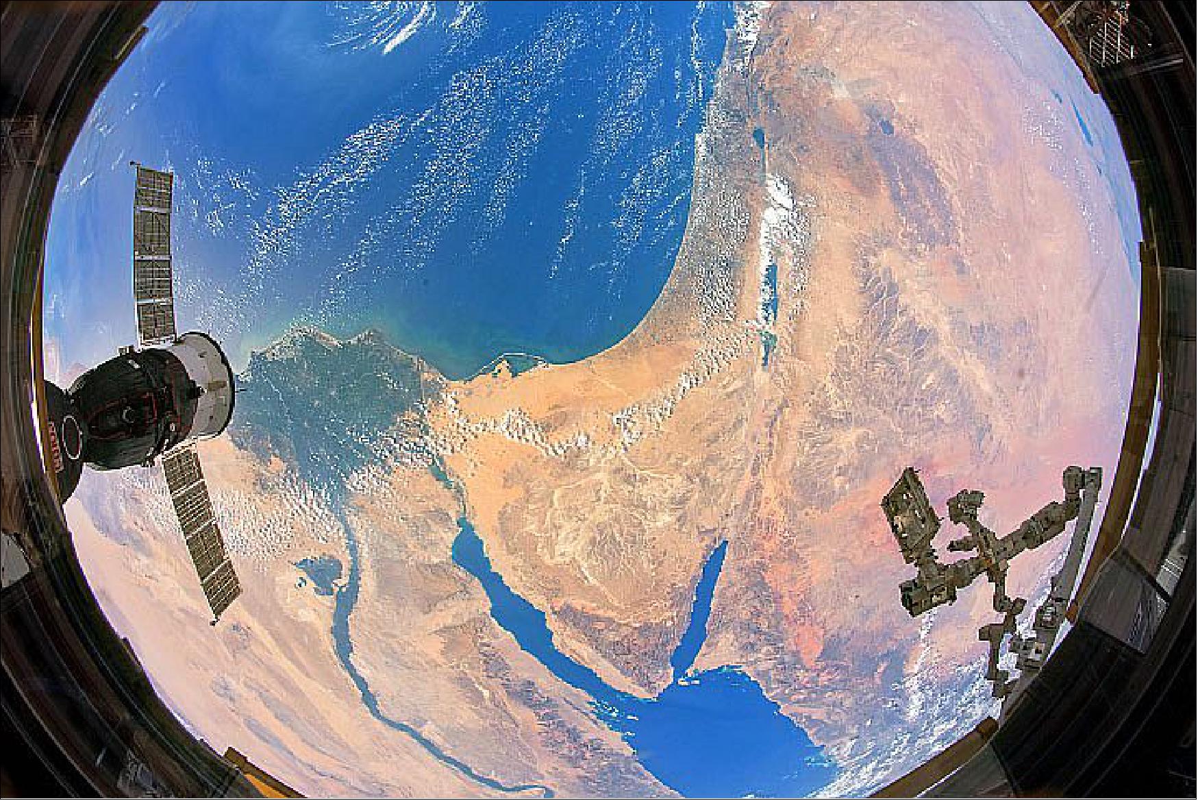 Figure 115: Astronaut Andrew Morgan used a fisheye lens to capture the intersection of two continents. The astronaut photograph ISS060-E-37265 was acquired on August 18, 2019, with a Nikon D5 digital camera using a 16 mm lens and is provided by the ISS Crew Earth Observations Facility and the Earth Science and Remote Sensing Unit, Johnson Space Center. The image was taken by a member of the Expedition 60 crew. The image has been cropped and enhanced to improve contrast, and lens artifacts have been removed (image credit: NASA Earth Observatory, caption by Laura Phoebus)