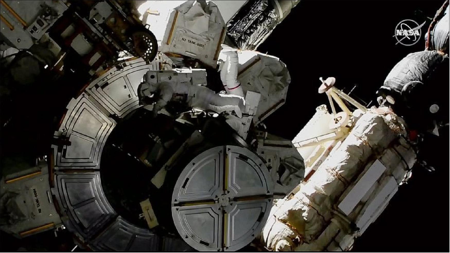 Figure 114: In this image provided by NASA shows NASA astronauts Victor Glover and Mike Hopkins on a spacewalk outside the ISS on Saturday, March 13, 2021. The astronauts are rearranging space station plumbing and tackling other odd jobs. The work should have been completed a week ago, but power upgrades took longer than expected (image credit: NASA)