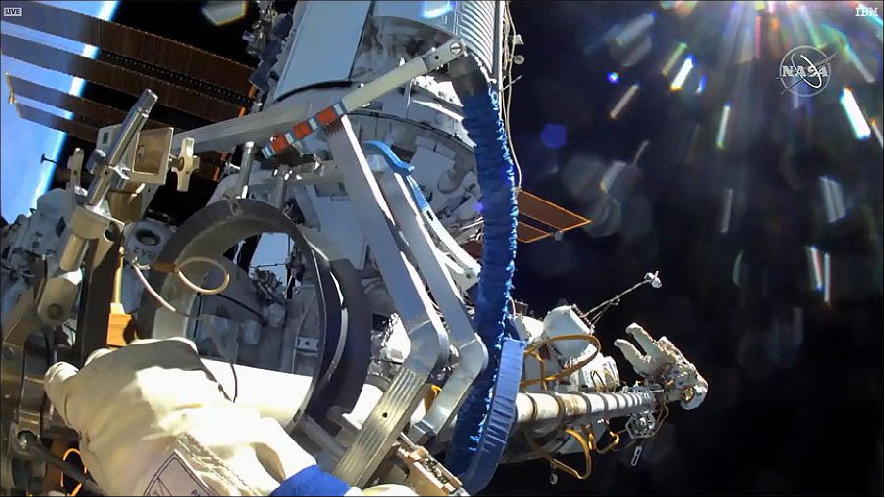 Figure 72: Pyotr Dubrov's helmet camera spots Oleg Novitskiy on the other end of the 46-foot-long (14 meters) Strela boom, a Russian crane, that the spacewalkers detached from the Pirs airlock (image credit: NASA)