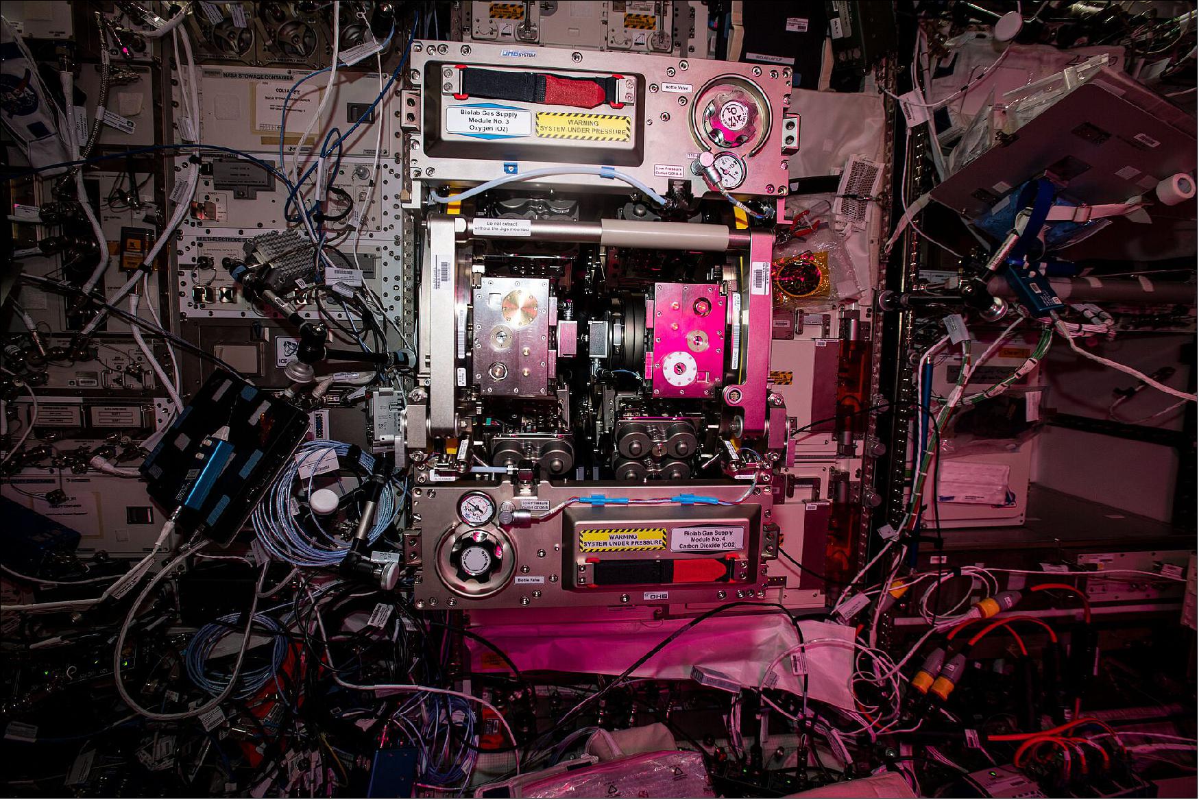 Figure 129: This image, taken in ESA's Columbus laboratory on the International Space Station, is a snapshot of the many opportunities in space research and exploration. In the center is the Biolab facility, a fridge-sized unit that hosts biological experiments on micro-organisms, cells, tissue cultures, small plants and small invertebrates. Performing life science experiments in space identifies the role that weightlessness plays at all levels of an organism, from the effects on a single cell up to a complex organism including humans (image credit: ESA/NASA)