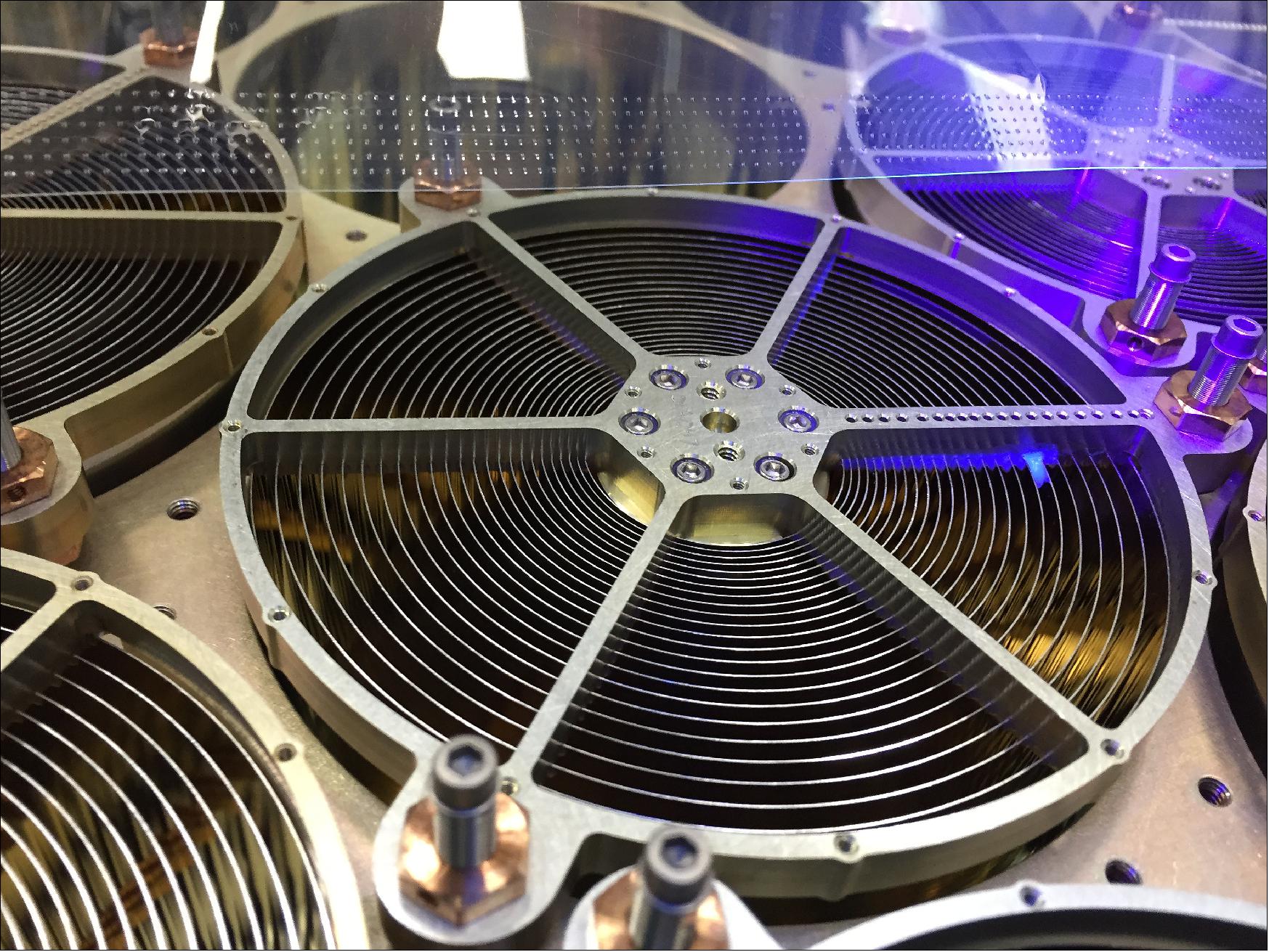Figure 29: NICER's mirror assemblies concentrate X-rays onto silicon detectors to gather data that probes the interior makeup of neutron stars, including those that appear to flash regularly, called pulsars (image credit: NASGSFC, Keith Gendreau)