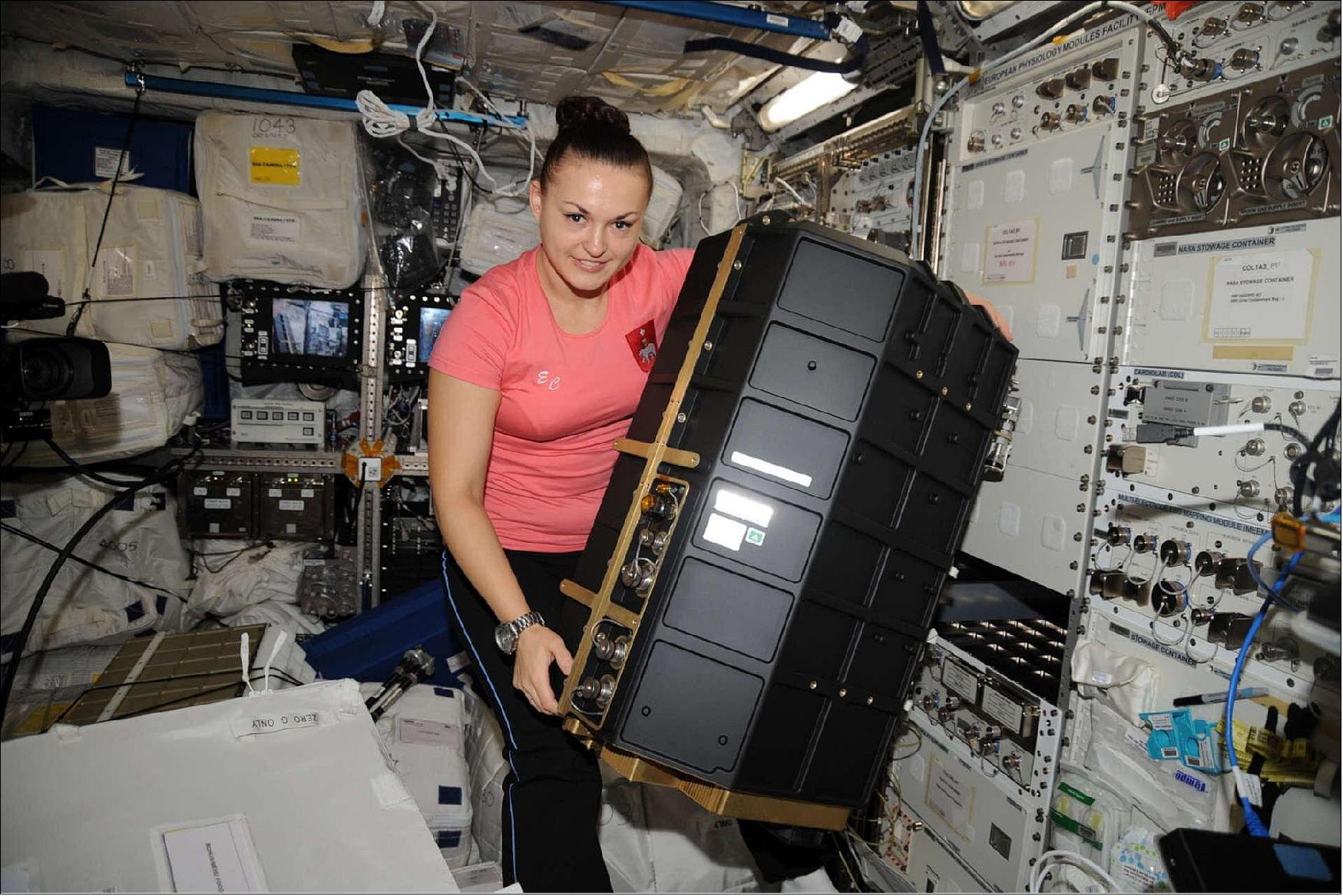 Figure 5: Roscosmos cosmonaut Elena Serove installing the Plasma Kristall-4 experiment in Europe's Columbus laboratory on the International Space Station in 2014 (image credit: ESA/NASA–T. Pesquet)