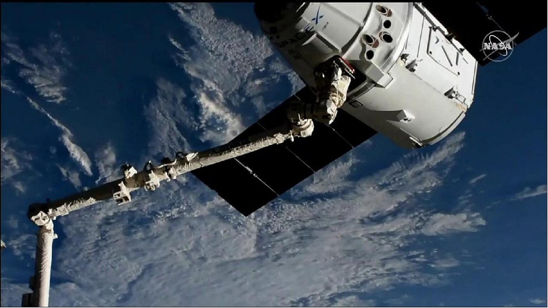 Figure 9: The SpaceX Dragon is in the grips of the Canadarm2 robotic arm shortly after it was captured over southern Chile (image credit: NASA)