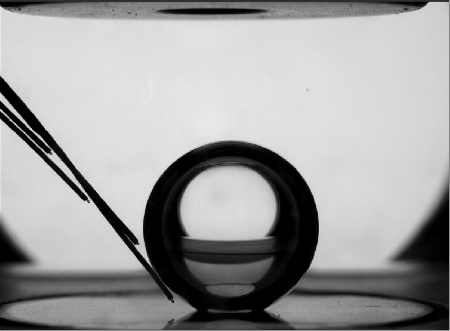 Figure 7: While the bubbles form, a number of measurements are taken. The temperature sensor in the left of this image measures bubble temperature while a high-speed camera records how the bubbles behave and an infrared camera tracks the temperature of the heated region (image credit: ESA)