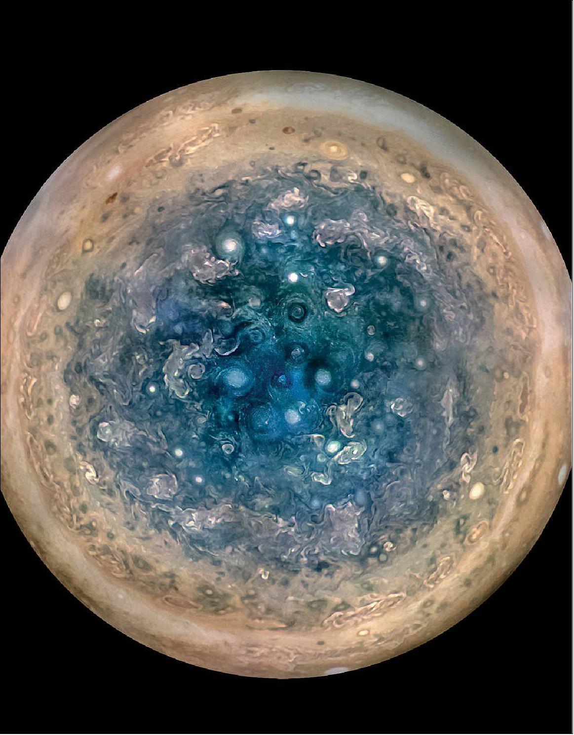 Figure 47: This image shows Jupiter's south pole, as seen by NASA's Juno spacecraft from an altitude of 32,000 miles (52,000 kilometers). The oval features are cyclones, up to 600 miles (1,000 kilometers) in diameter. Multiple images taken with the JunoCam instrument on three separate orbits were combined to show all areas in daylight, enhanced color, and stereographic projection (image credits: NASA/JPL-Caltech/SwRI/MSSS/Betsy Asher Hall/Gervasio Robles)