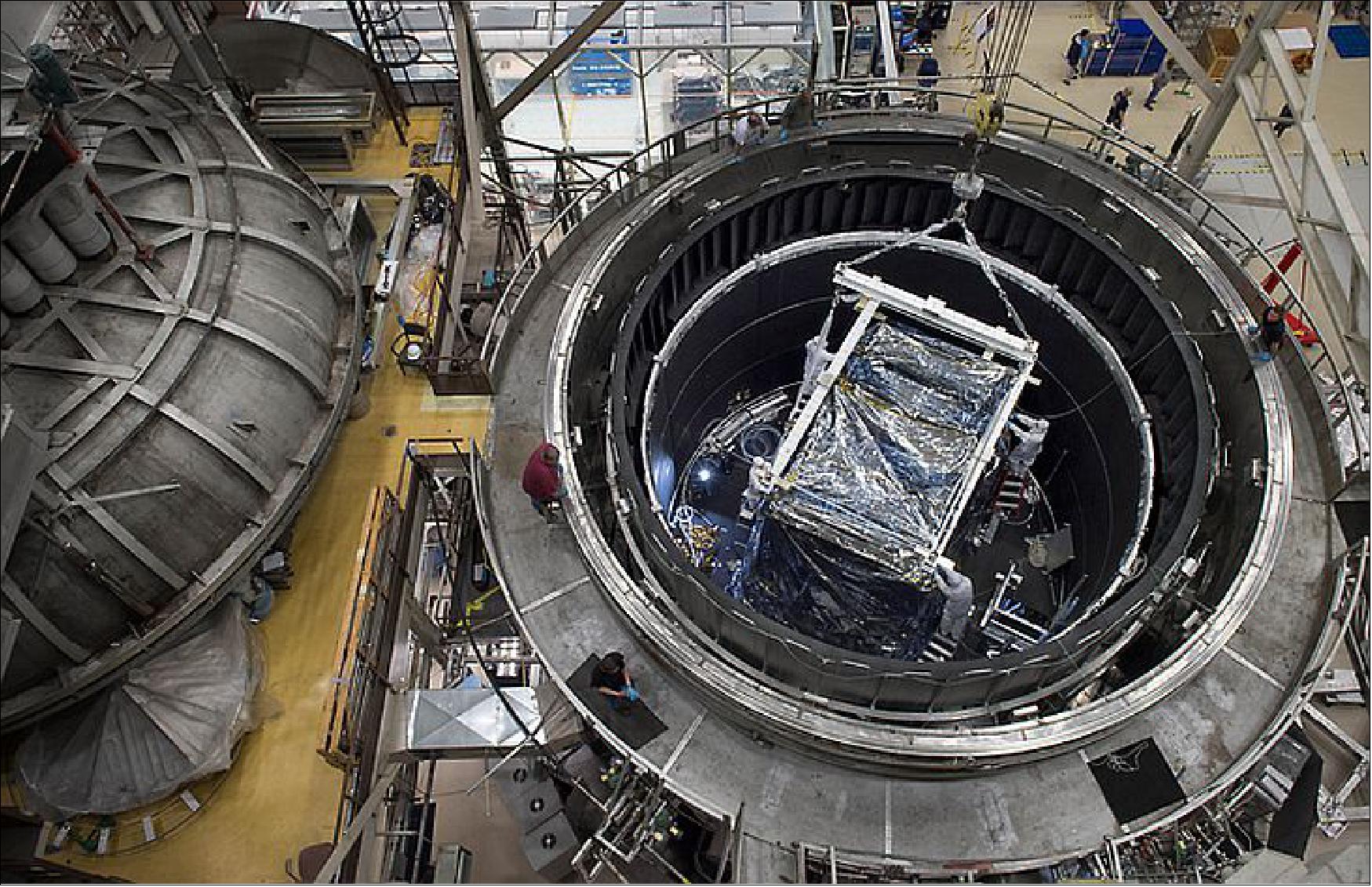 Figure 70: A crane lifts ISIM, the heart of the JWST, from the Goddard Thermal Vacuum Chamber where it spent 116 days in a space-like environment (image credit: NASA, Chris Gunn)