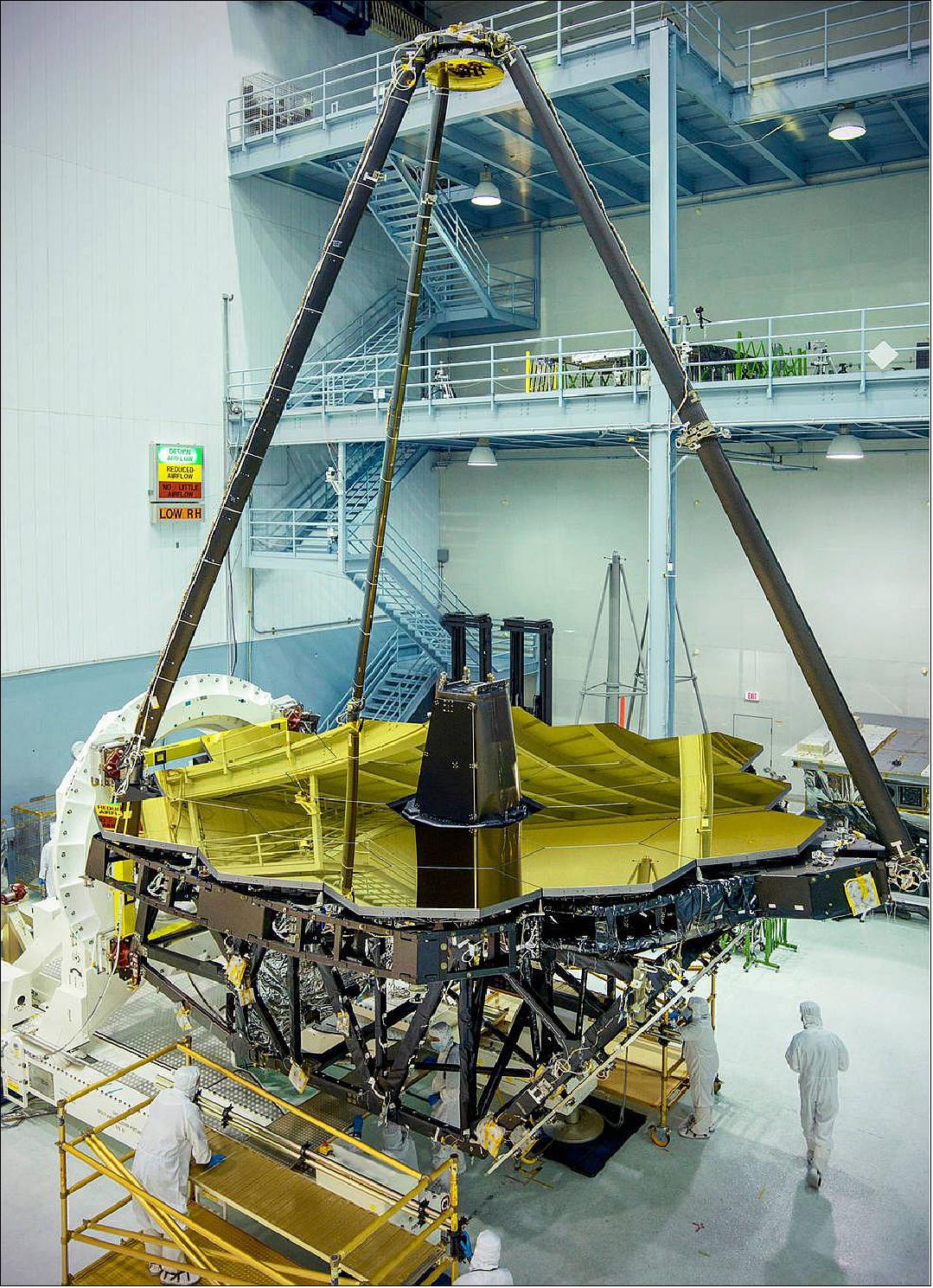Figure 59: Standing tall and glimmering gold inside the NASA/GSFC clean room in Greenbelt, Maryland is the James Webb Space Telescope primary mirror. It will be the largest yet sent into space (image credit: NASA, Chris Gunn)