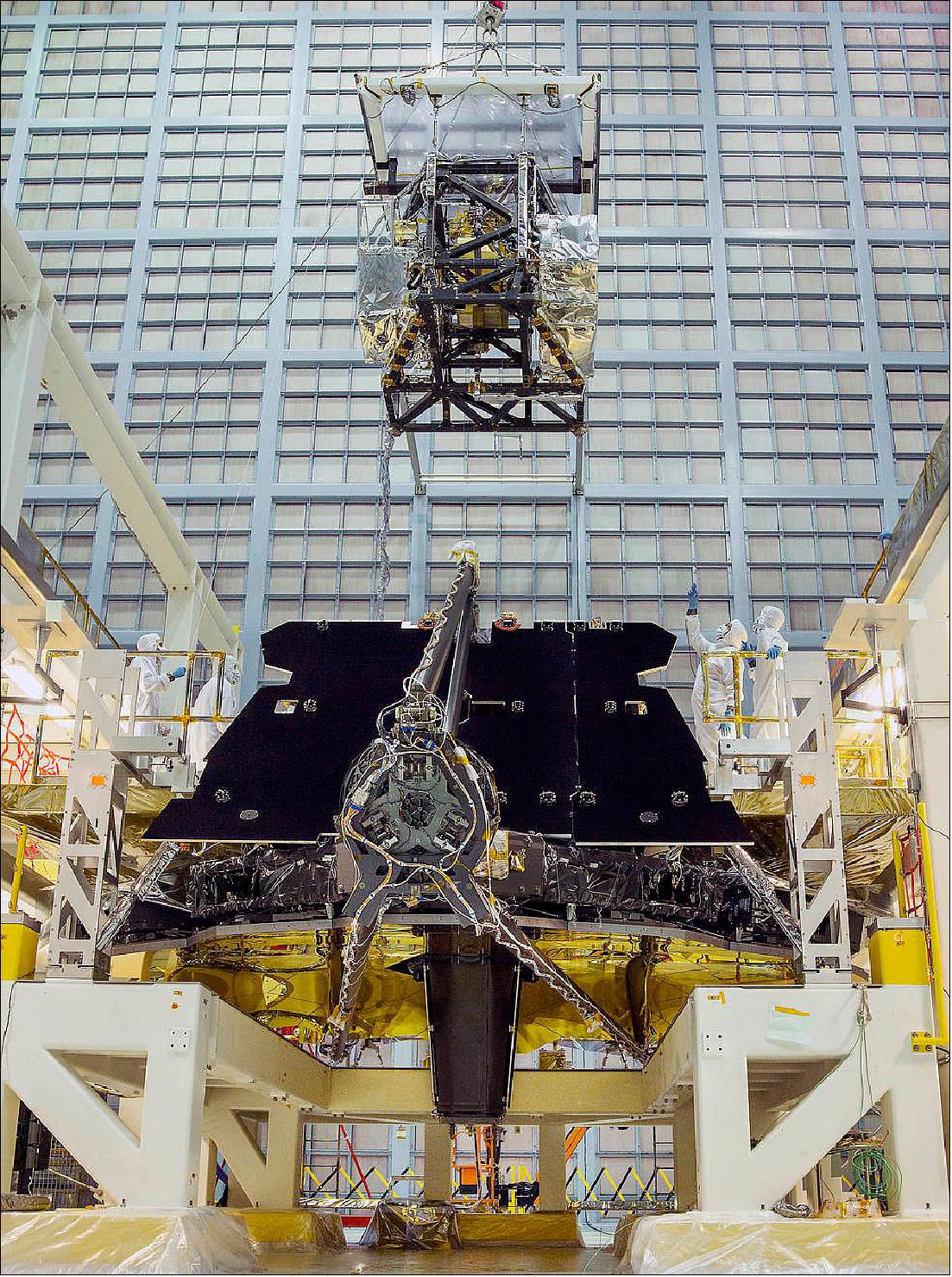 Figure 58: In this view, the James Webb Space Telescope team crane lifted the science instrument package for installation into the telescope structure (image credit: NASA, Chris Gunn)