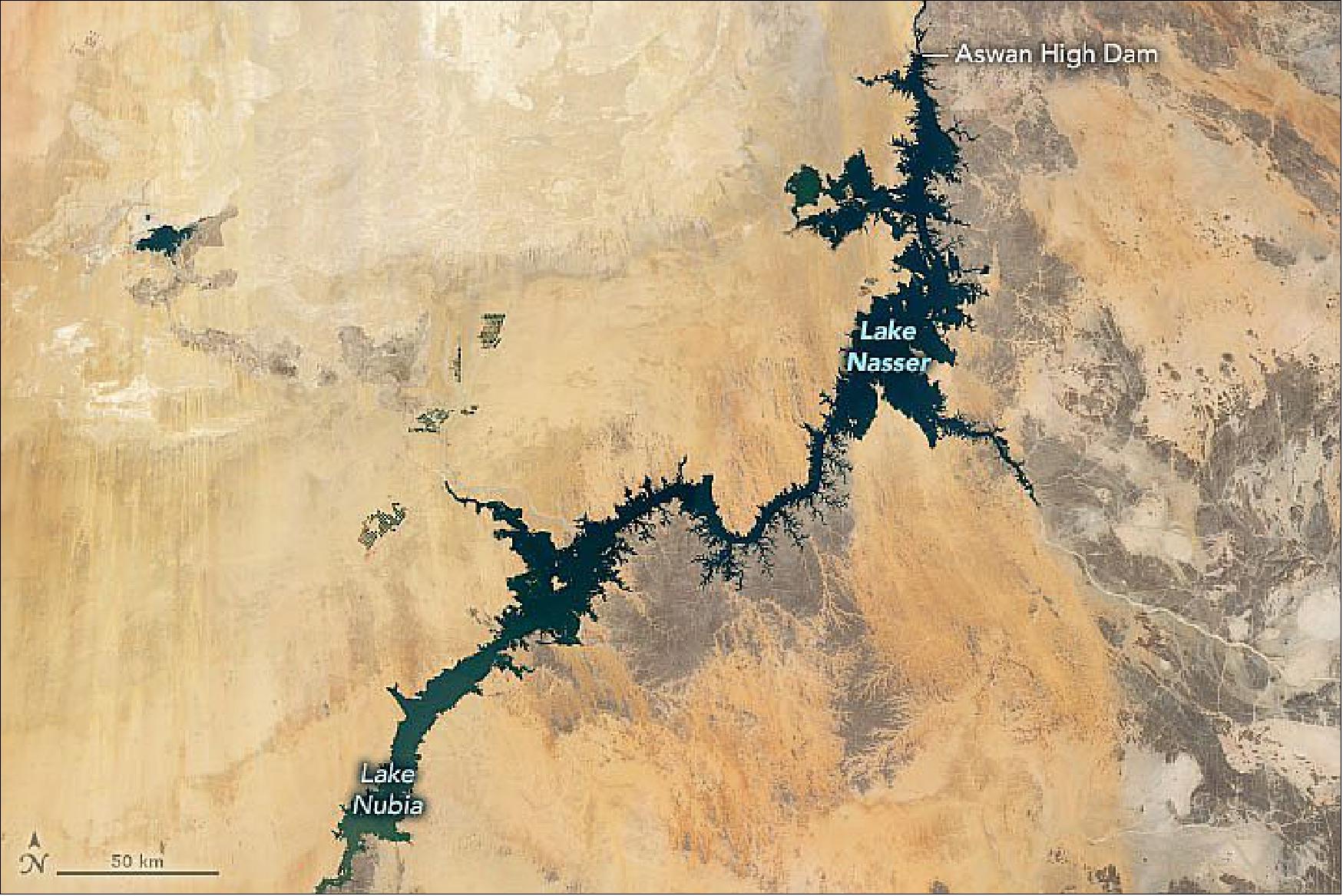 Figure 66: The Operational Land Imager (OLI) on Landsat 8 acquired the data for this natural-color image of Lake Nasser (the Sudanese call their portion Lake Nubia). This composite scene was compiled from cloud-free images from 2013 to 2020. Located in a hot, dry climate with sporadic rain events, the lake loses a lot of water through evaporation and consequently shrinks seasonally in surface area. Water levels are typically highest in November during the flood season and lowest in July during the dry season (image credit: NASA Earth Observatory, image by Joshua Stevens, using Landsat data from the U.S. Geological Survey. Story by Kasha Patel)