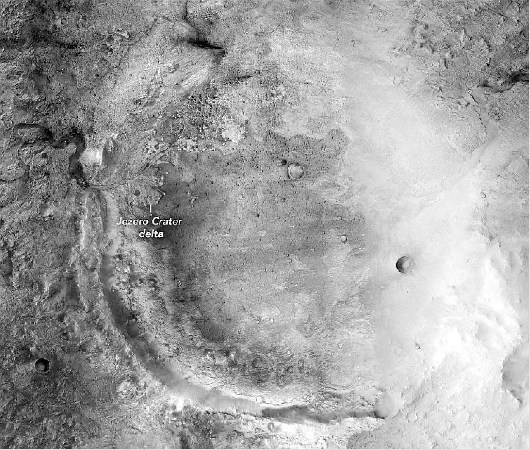 Figure 59: This image shows Jezero Crater as observed by MRO’s Context Camera. Spectral data showed signatures of carbonates on the western edge of the crater, which scientists believe to be the shoreline and beaches of an ancient lake. The carbonates are also present in the delta, which is the planned site of the Perseverance landing (image credit: Jezero Crater image courtesy of NASA / JPL-Caltech / MSSS / Tanya Harrison)