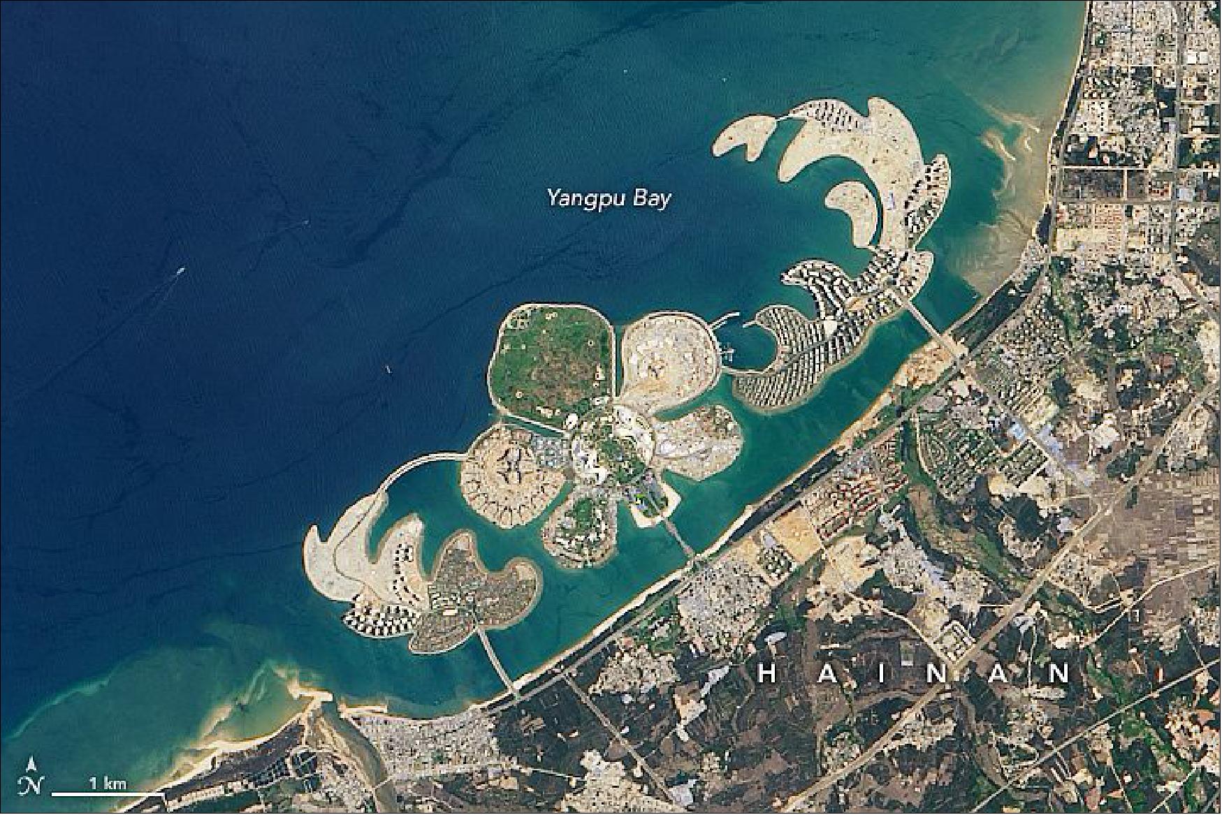 Figure 50: The Operational Land Imager (OLI) on Landsat 8 captured this natural-color image of the new island on May 6, 2020, as construction was wrapping up and the island neared its full opening in late 2020 (image credit: NASA Earth Observatory, images by Lauren Dauphin, using Landsat data from the U.S. Geological Survey. Story by Adam Voiland)
