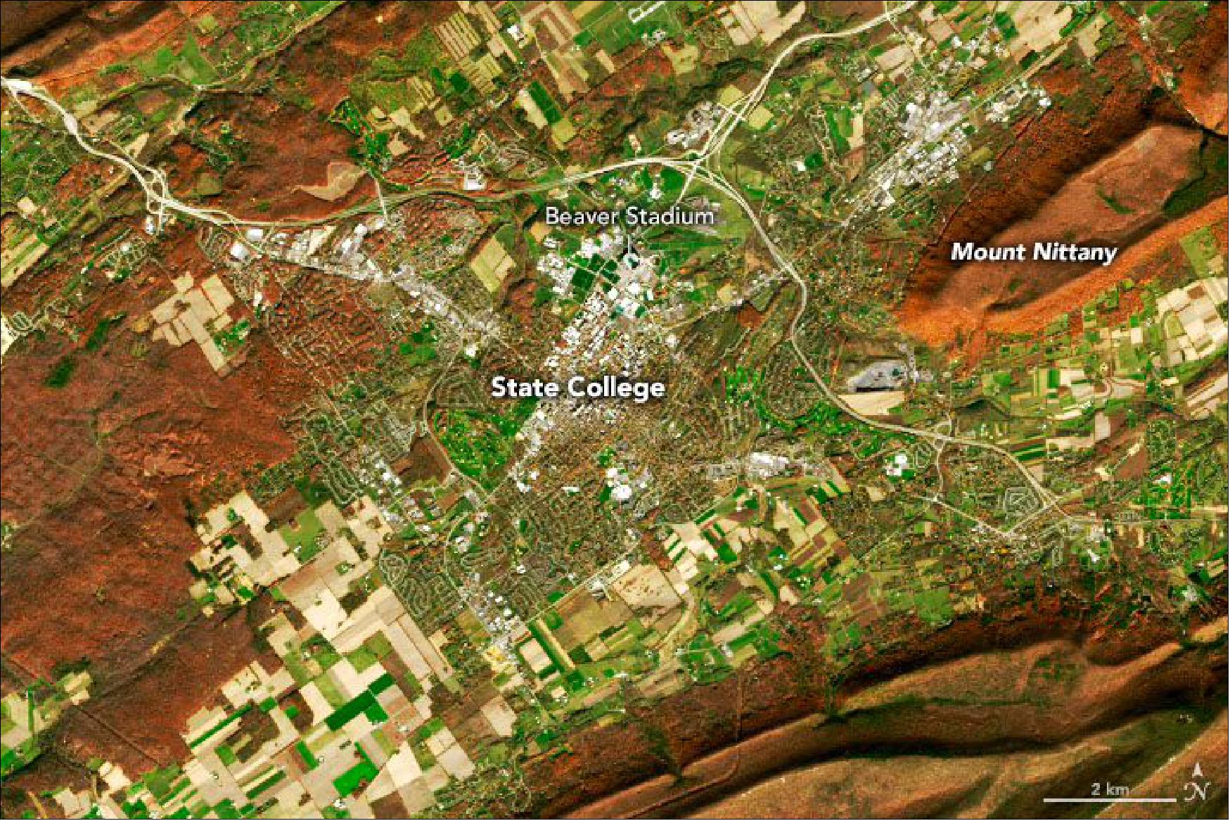 Figure 13: Detail image of State College, Pennsylvania. The close-up and oblique satellite views capture Mount Nittany, State College, and University Park, home of The Pennsylvania State University. The mascot of the university and several other groups in the area is the Nittany Lion, a localized name for the now-extinct eastern cougar (image credit: NASA Earth Observatory)