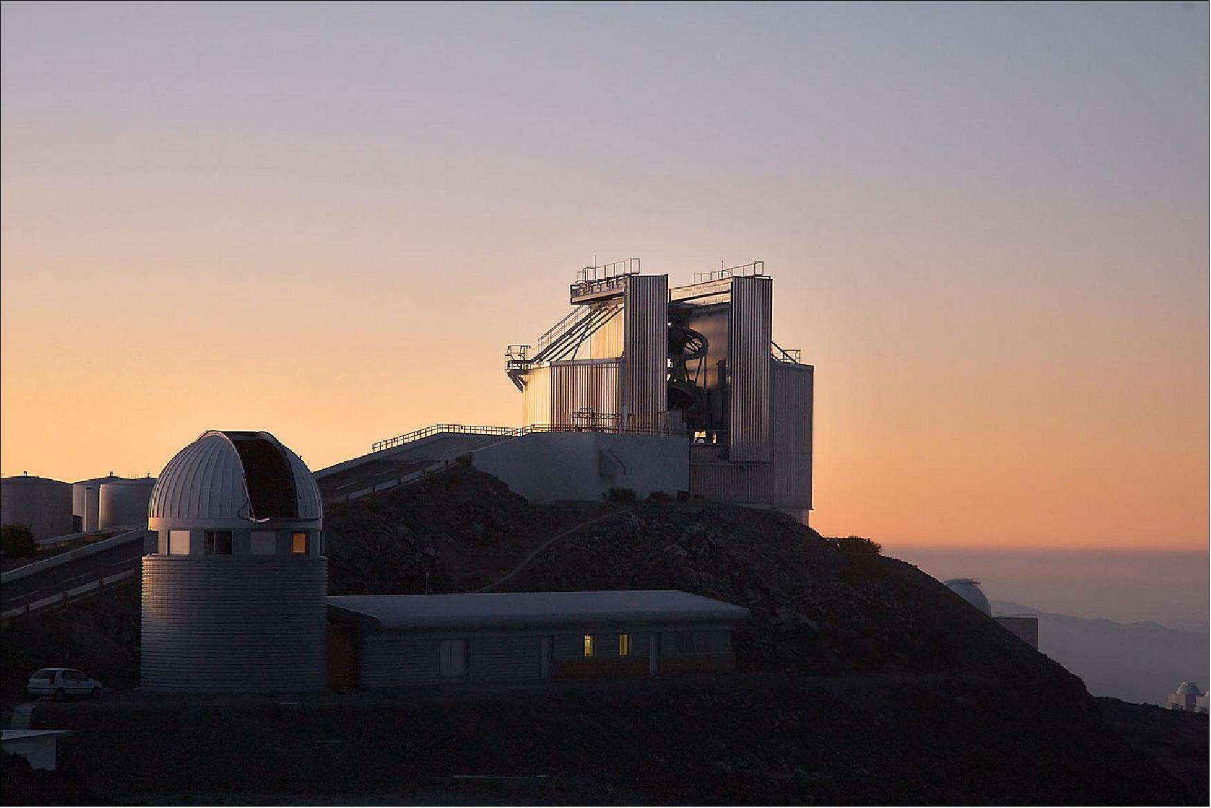 Figure 7: The sun sets behind the New Technology Telescope (NTT) at ESO's La Silla observation site. La Silla, in the southern part of the Atacama desert of Chile, was ESO's first observation site. Home to ESO 3.6-meter telescope and the 3.58-meter New Technology Telescope (NTT), the site sits 2400 m above sea level, creating excellent viewing conditions for astronomers. La Silla also hosts many national telescopes, including the Swiss 1.2-meter Leonhard Euler Telescope and the Danish 1.54-metere telescope (image credit: ESO, Iztok Boncina)