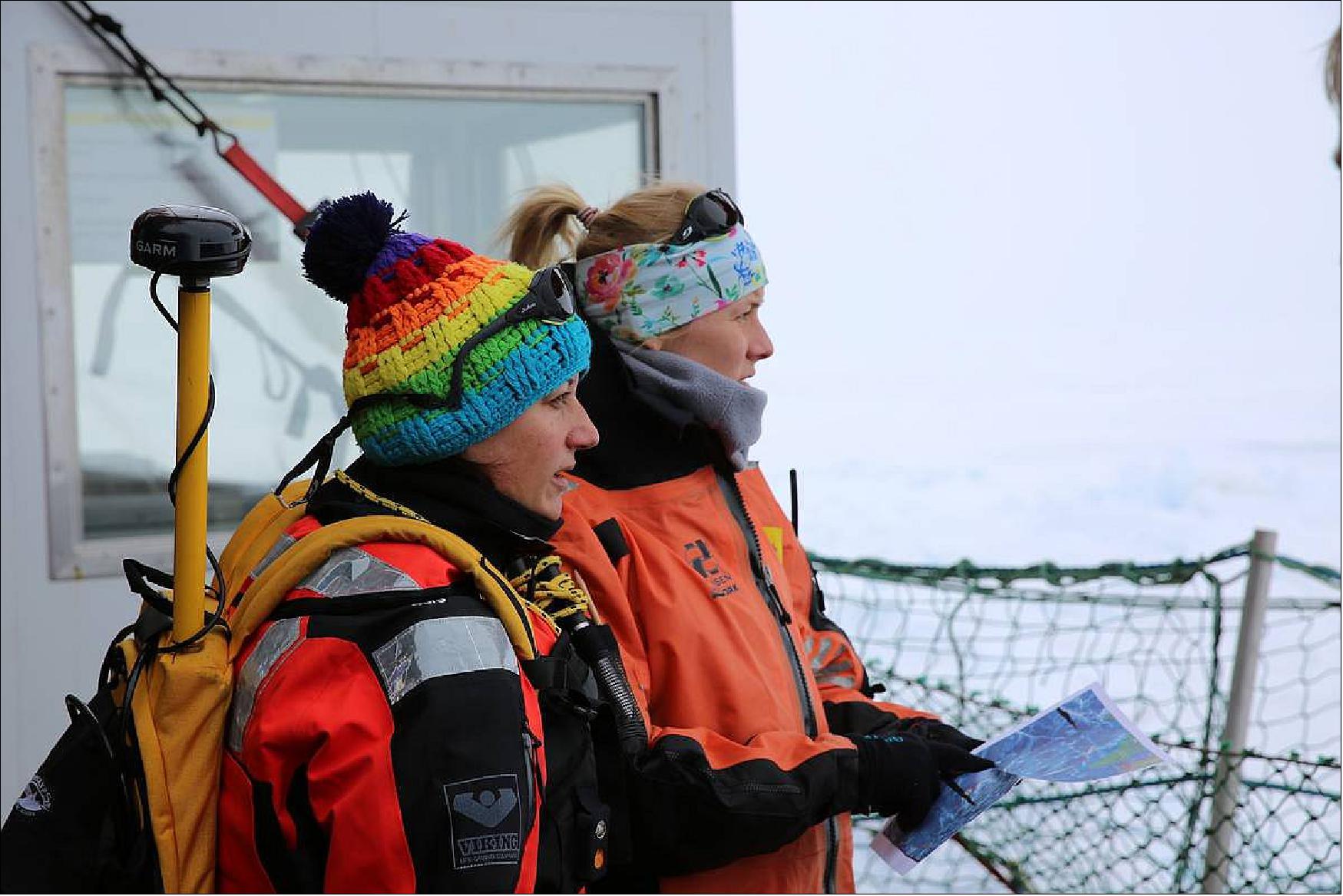 Figure 27: Julia Regnery and Amy Macfarlane looking to MOSAiC Floe before they start their exploring tour on the MOSAiC Fortress. This was at the first day during Leg 4 when we reached the floe (Photo: AWI, Lisa Grosfeld)