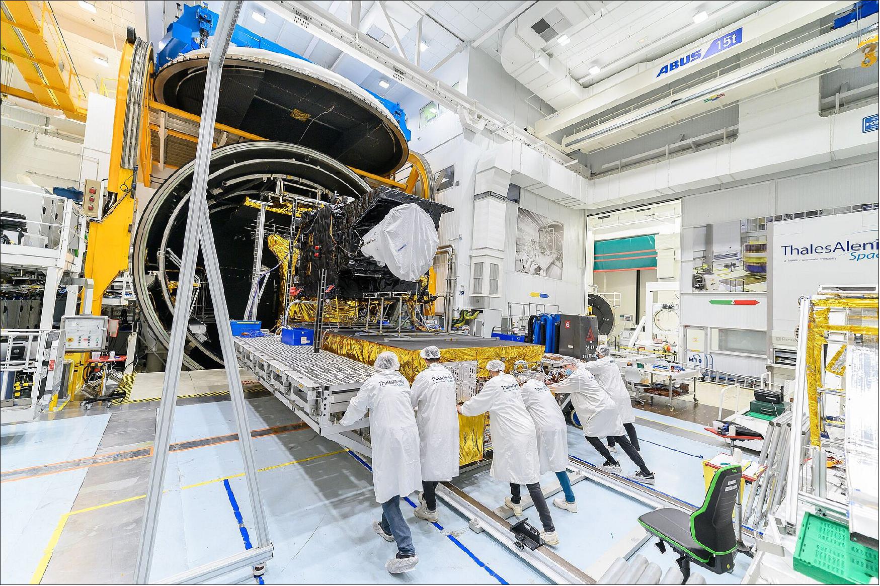 Figure 13: The Meteosat Third Generation Imager satellite being pushed into the thermal vacuum chamber for testing at Thales Alenia Space’s facilities in Cannes, France, in October 2021. These tests simulate the thermal conditions that the satellite will experience in orbit above Earth and demonstrate that the satellite will function correctly in the harsh environment of space. To meet more than the 20-year operational life of the mission, the full MTG system comprises six satellites, four MTG-I and two MTG-S. The first MTG-I is scheduled to launch at the end of 2022 (image credit: Thales Alenia Space)