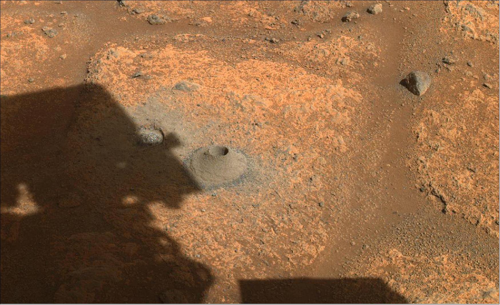 Figure 15: This image taken by NASA's Perseverance rover on August 6, 2021, shows the hole drilled in a Martian rock in preparation for the rover's first attempt to collect a sample. It was taken by one of the rover's hazard cameras in what the rover's science team has nicknamed a "paver rock" in the "Crater Floor Fractured Rough" area of Jezero Crater (image credit: NASA/JPL-Caltech)