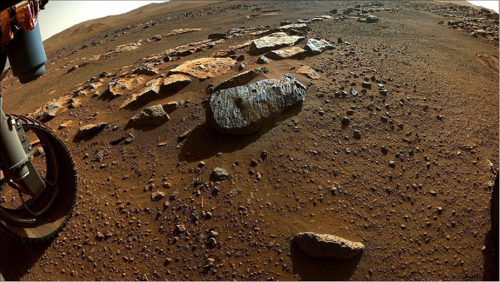 Figure 13: Two holes are visible in the rock, nicknamed "Rochette," from which NASA's Perseverance rover obtained its first core samples. The rover drilled the hole on the left, called "Montagnac," on Sept. 7, and the hole on the right, known as "Montdenier," on Sept. 1. Below it is a round spot the rover abraded (image credit: NASA/JPL-Caltech)
